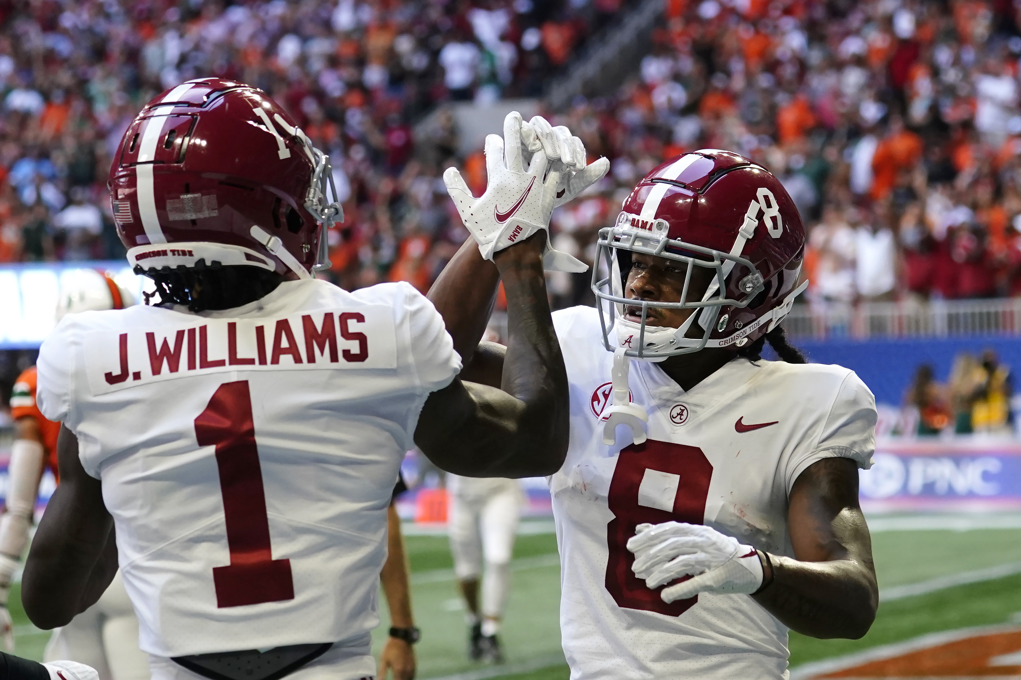 ATLANTA, GA – SEPTEMBER 04: Alabama's Evan Neal (73) places a leather  helmet on head coach Nick Saban following the conclusion of the Chick-fil-A  Kick-Off Game between the Miami Hurricanes and the