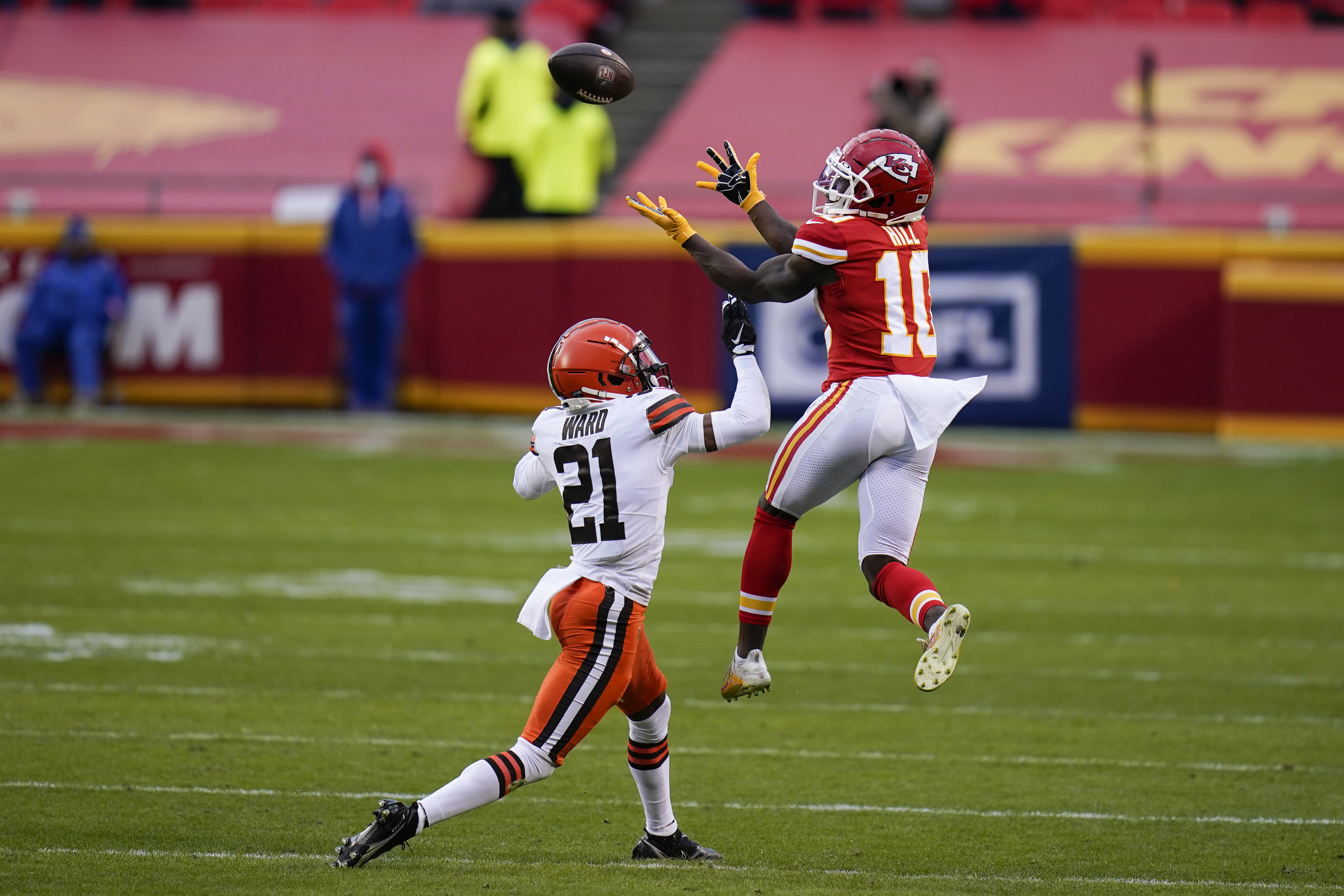 Kansas City Chiefs offensive coordinator Eric Bieniemy talks to Chiefs  tight end Travis Kelce (87) after their win over the Buffalo Bills in an  NFL divisional playoff football game, Sunday, Jan. 23