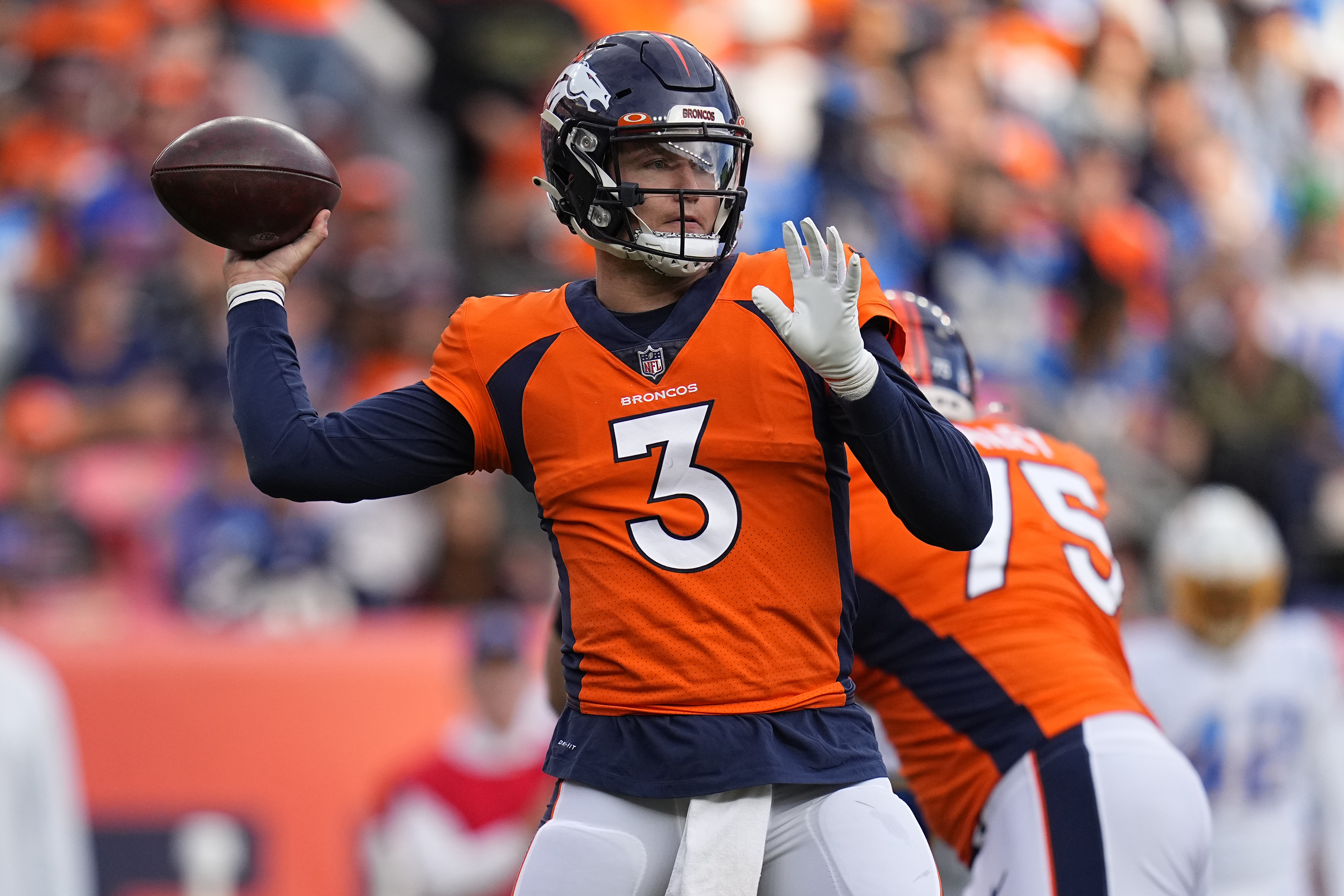 Interceptions lead to Chargers' 28-13 loss to Broncos