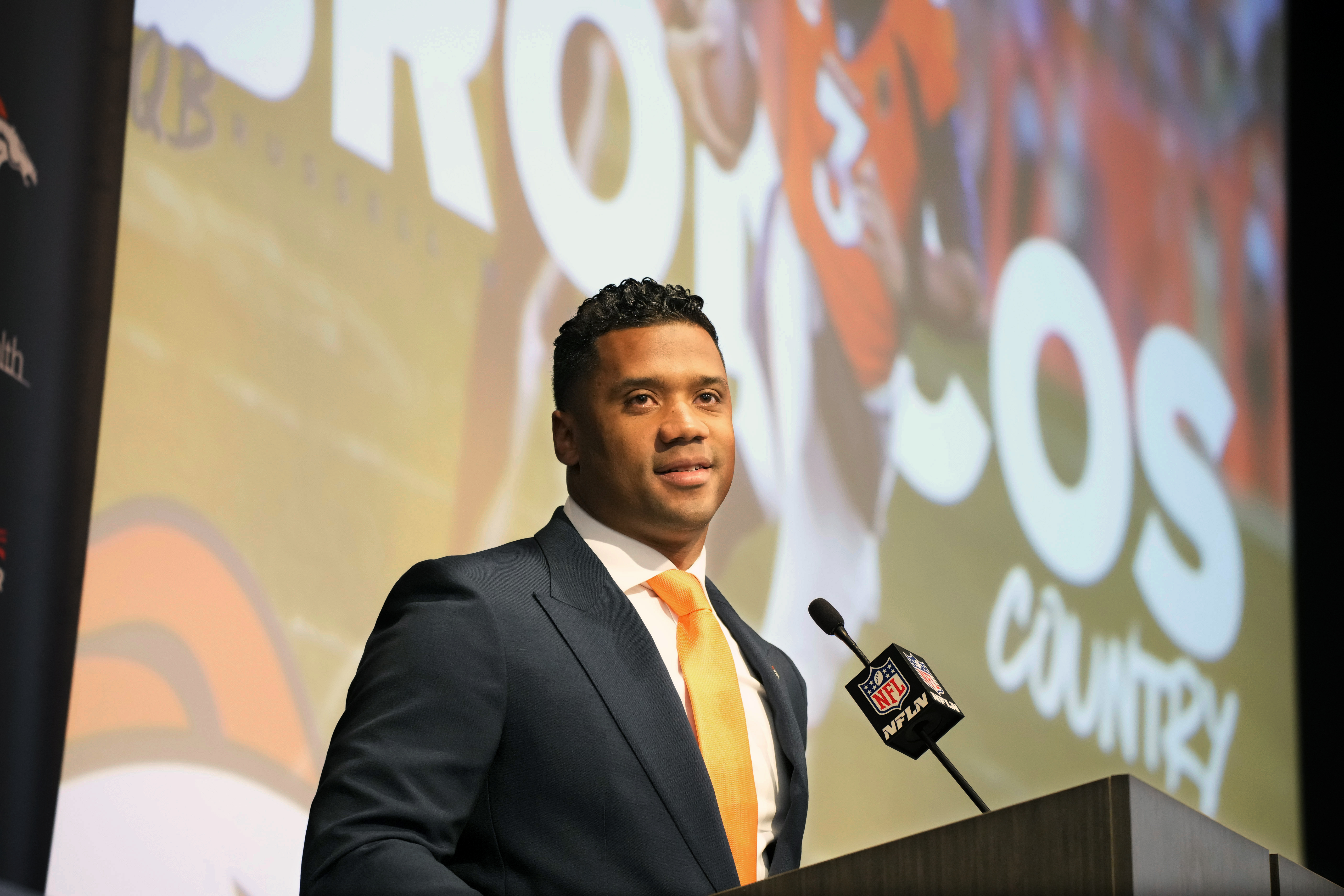 Russell Wilson Goes Chic in a Teal Suit for Broncos vs. Seahawks