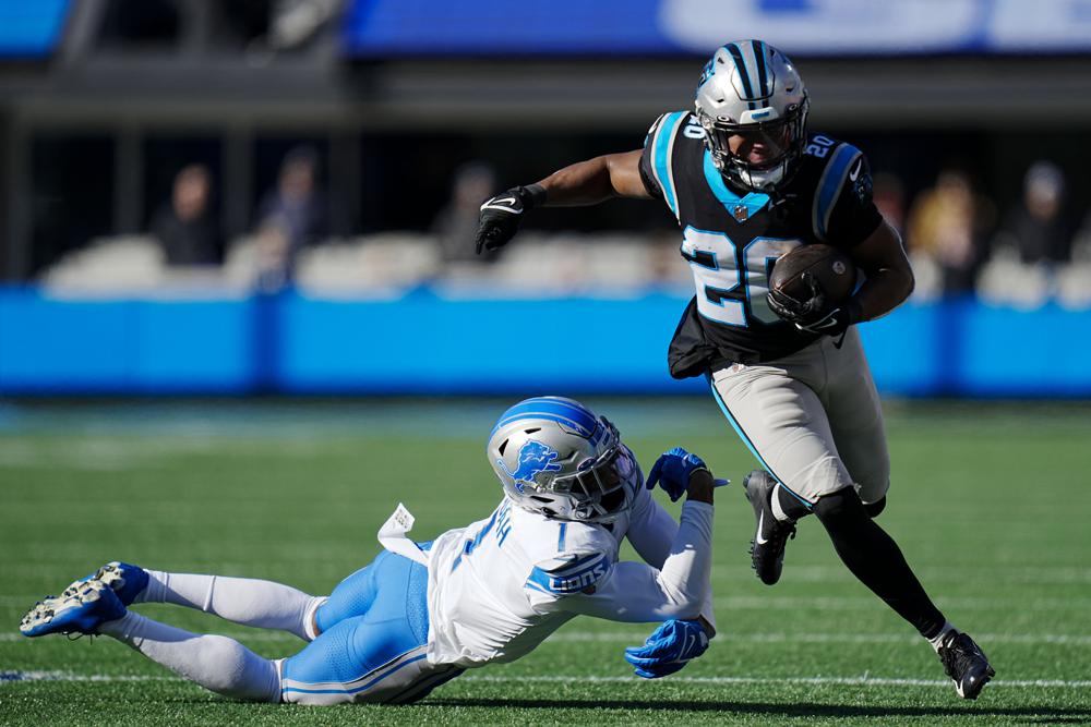 Charlotte, NC USA; Carolina Panthers quarterback Sam Darnold (14) runs in  for a touchdown during an NFL game against the Detroit Lions at Bank of  America Stadium, Saturday, December 24, 2022. The