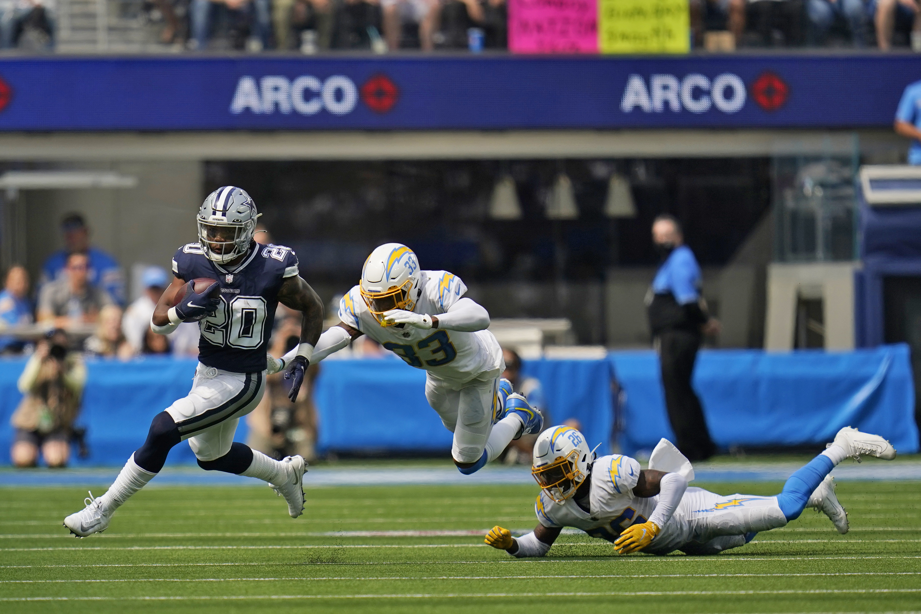 Running back (20) Tony Pollard of the Dallas Cowboys runs and scores a  touchdown against the Los Angeles Chargers in an NFL football game, Sunday,  Sept. 19, 2021, in Inglewood, Calif. The