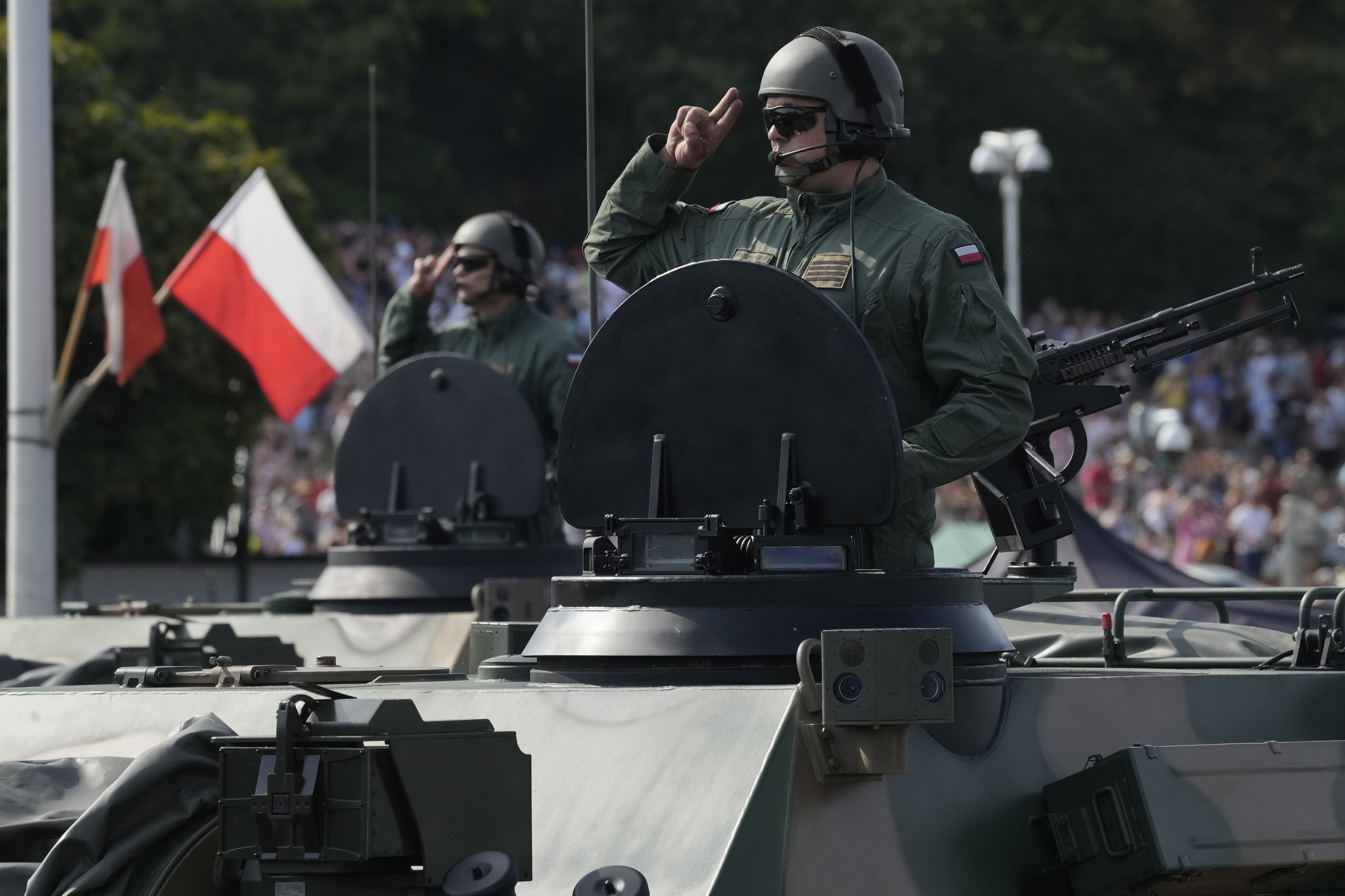 Poland showcases its growing army on a holiday that celebrates its 
