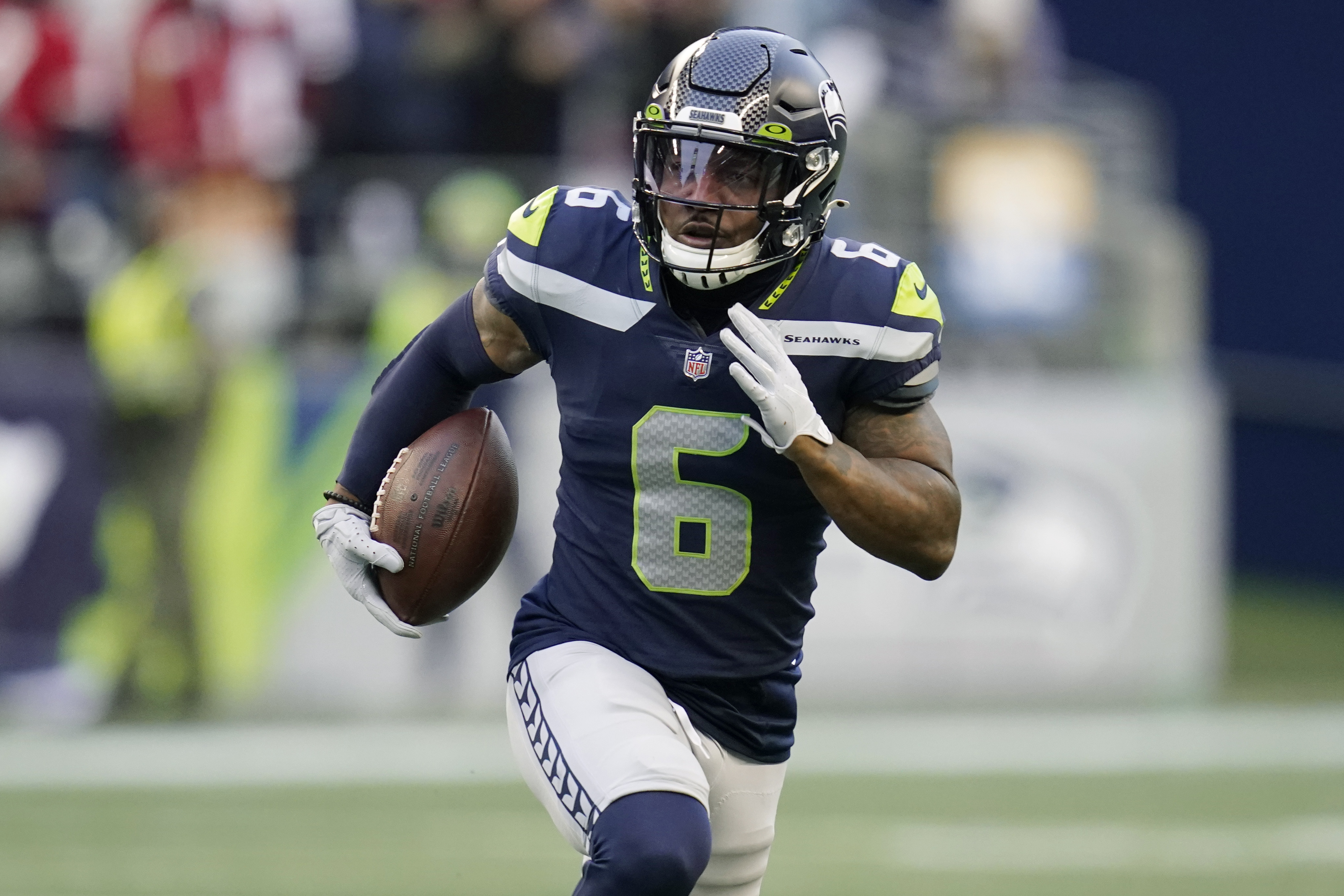 Seahawks receiver Dee Eskridge injured on opening kickoff of