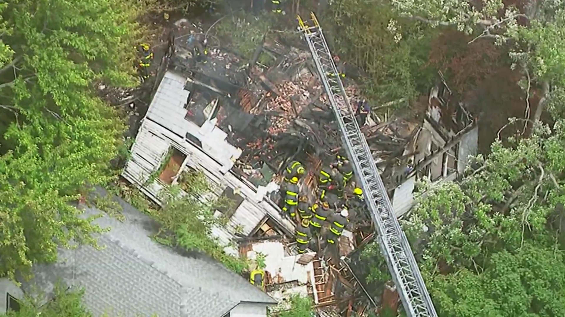 2 firefighters rescued after burning building collapses on them in