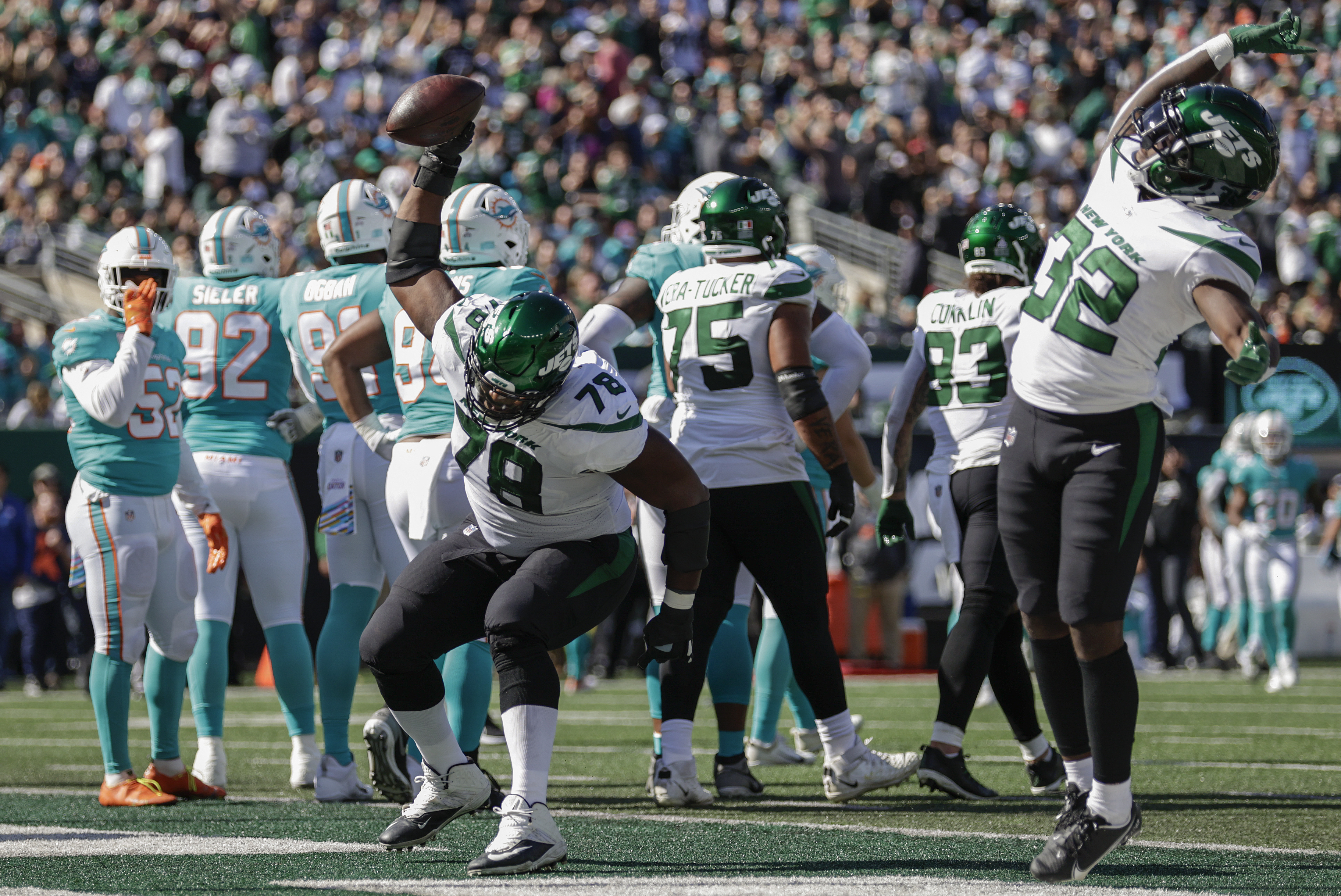 The New York Jets and Miami Dolphins line up at the line of scrimmage  during the third quarter of an NFL football game, Sunday, Dec. 8, 2019, in  East Rutherford, N.J. (AP