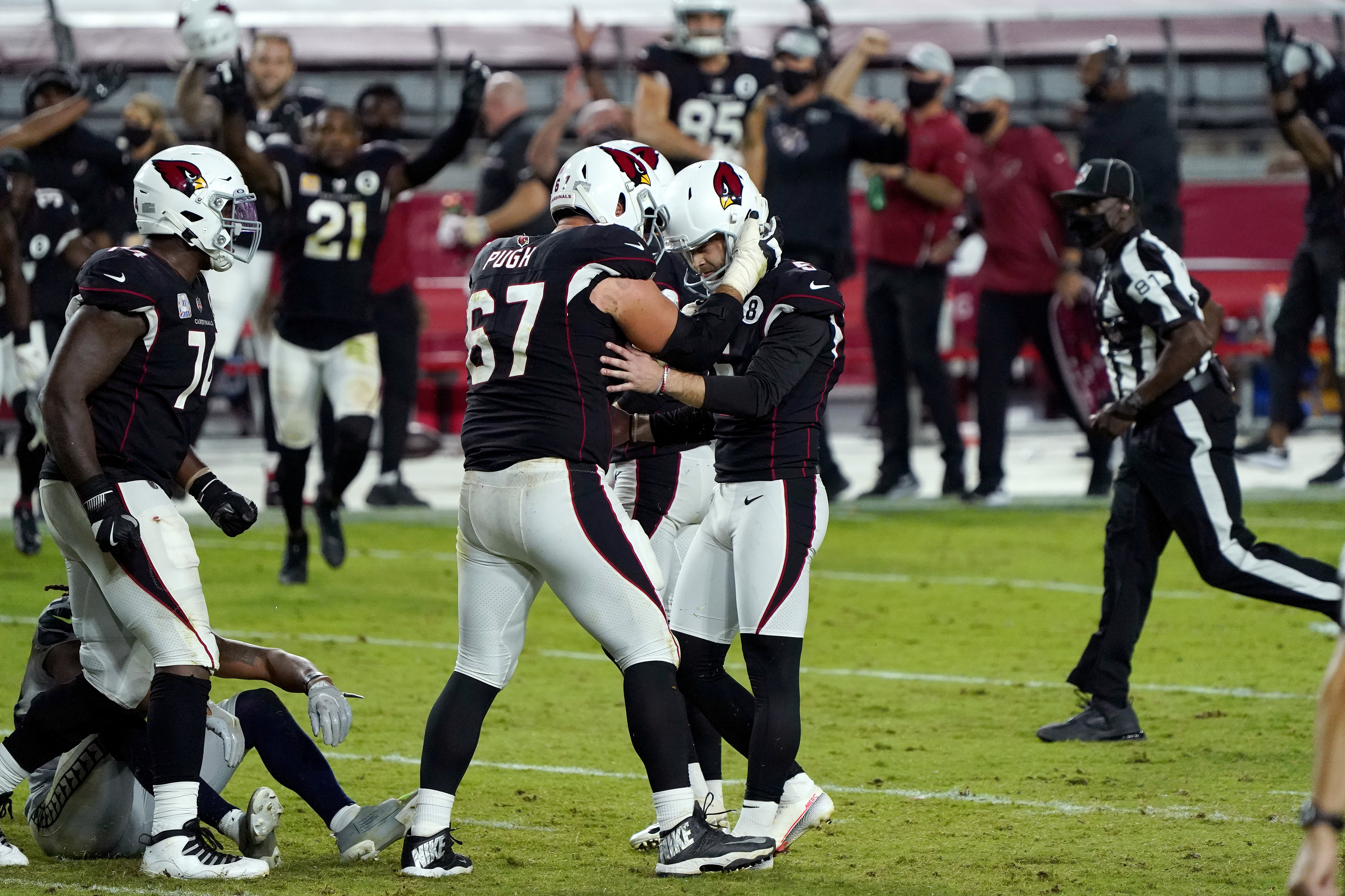 Cardinals' Budda Baker leaves field on stretcher after helmet-to