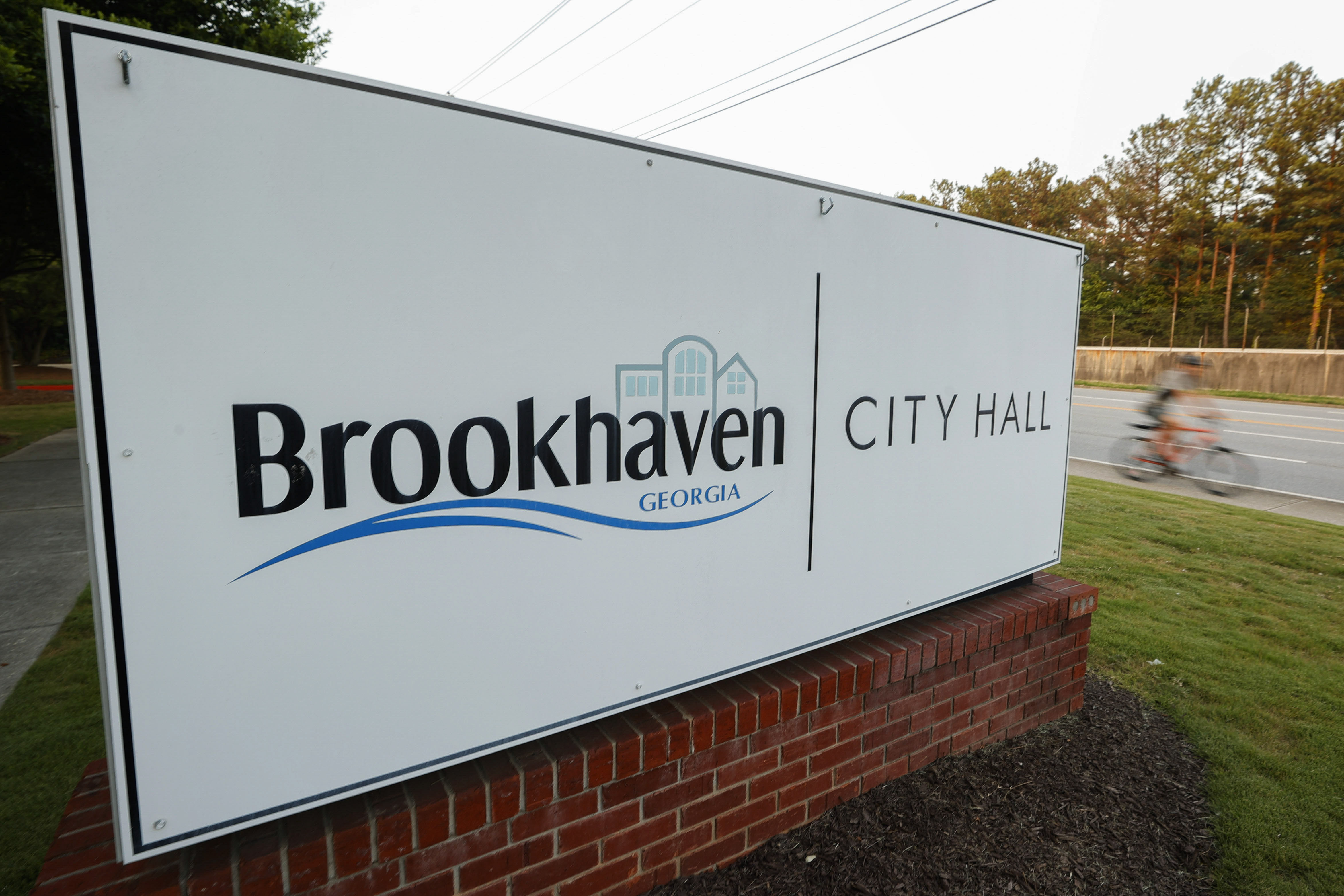 A pedestrian walks through Town Brookhaven, a mixed-use