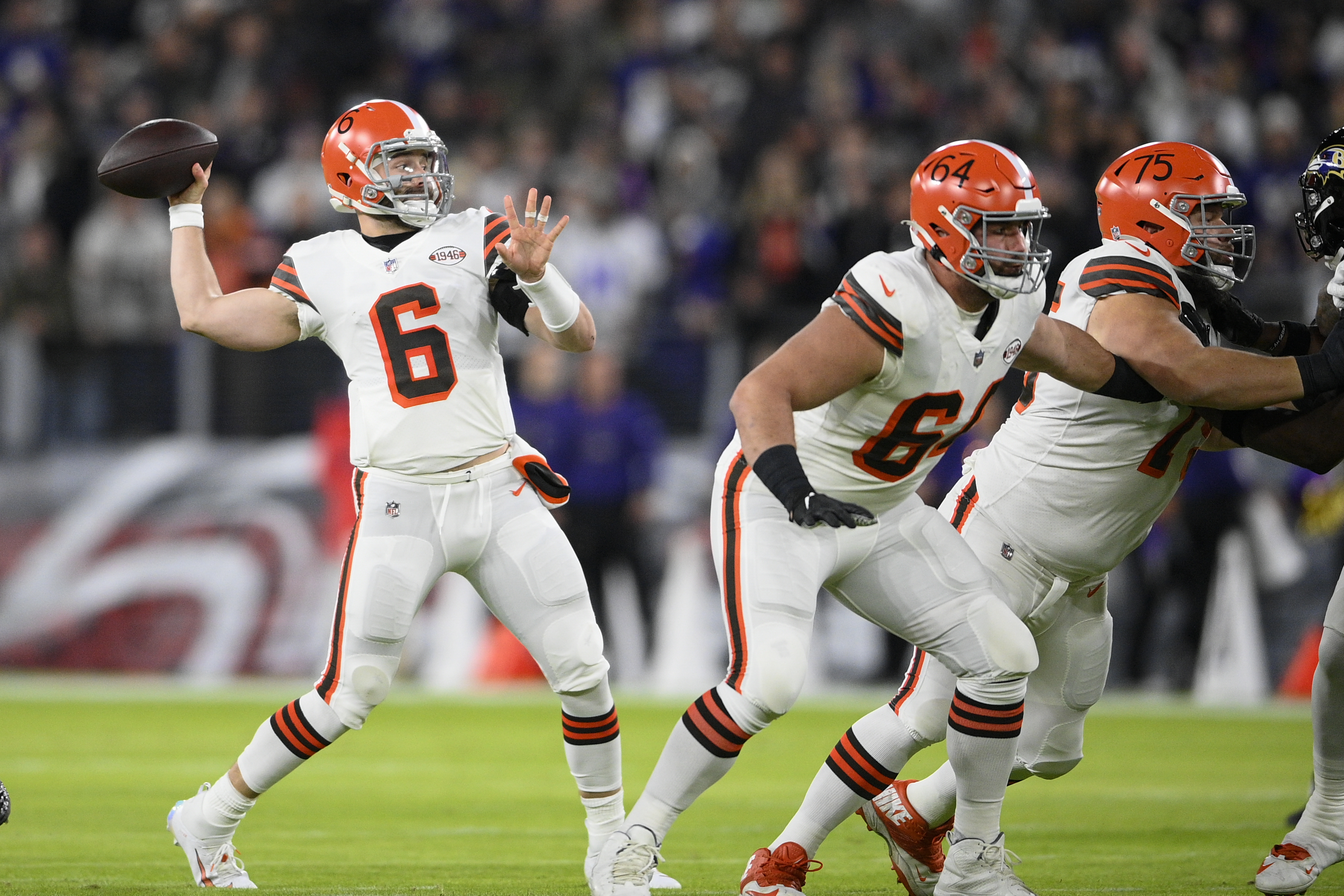 Cleveland Browns quarterback Baker Mayfield (6) and guard Joel Bitonio (75)  talk with head coac …