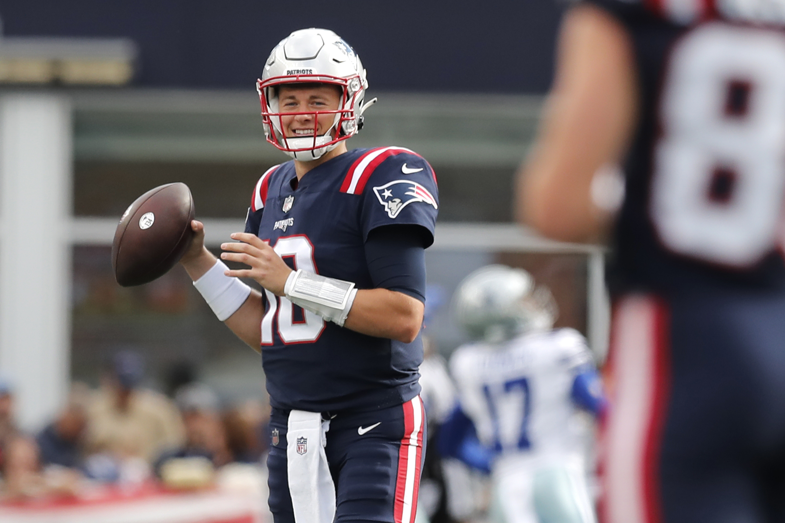 A member of the New England Patriots wears a sweatshirt with the crucial  catch logo during overtime of an NFL football game against the Dallas  Cowboys, Sunday, Oct. 17, 2021, in Foxborough