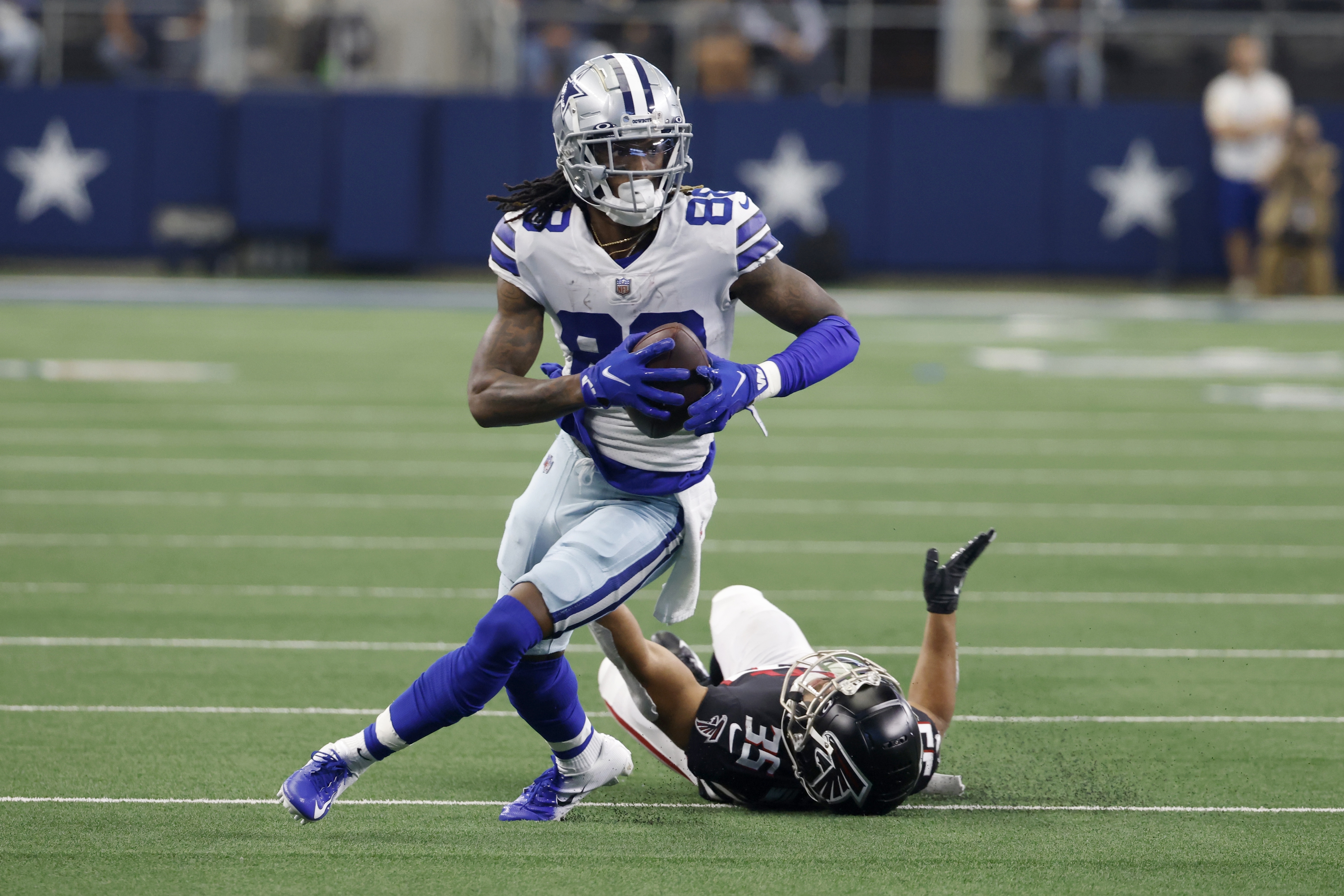 Dallas Cowboys' Dak Prescott (4) and CeeDee Lamb (88) celebrate after Lamb's  touchdown catch in the first half of an NFL football game against the  Atlanta Falcons in Arlington, Texas, Sunday, Nov.