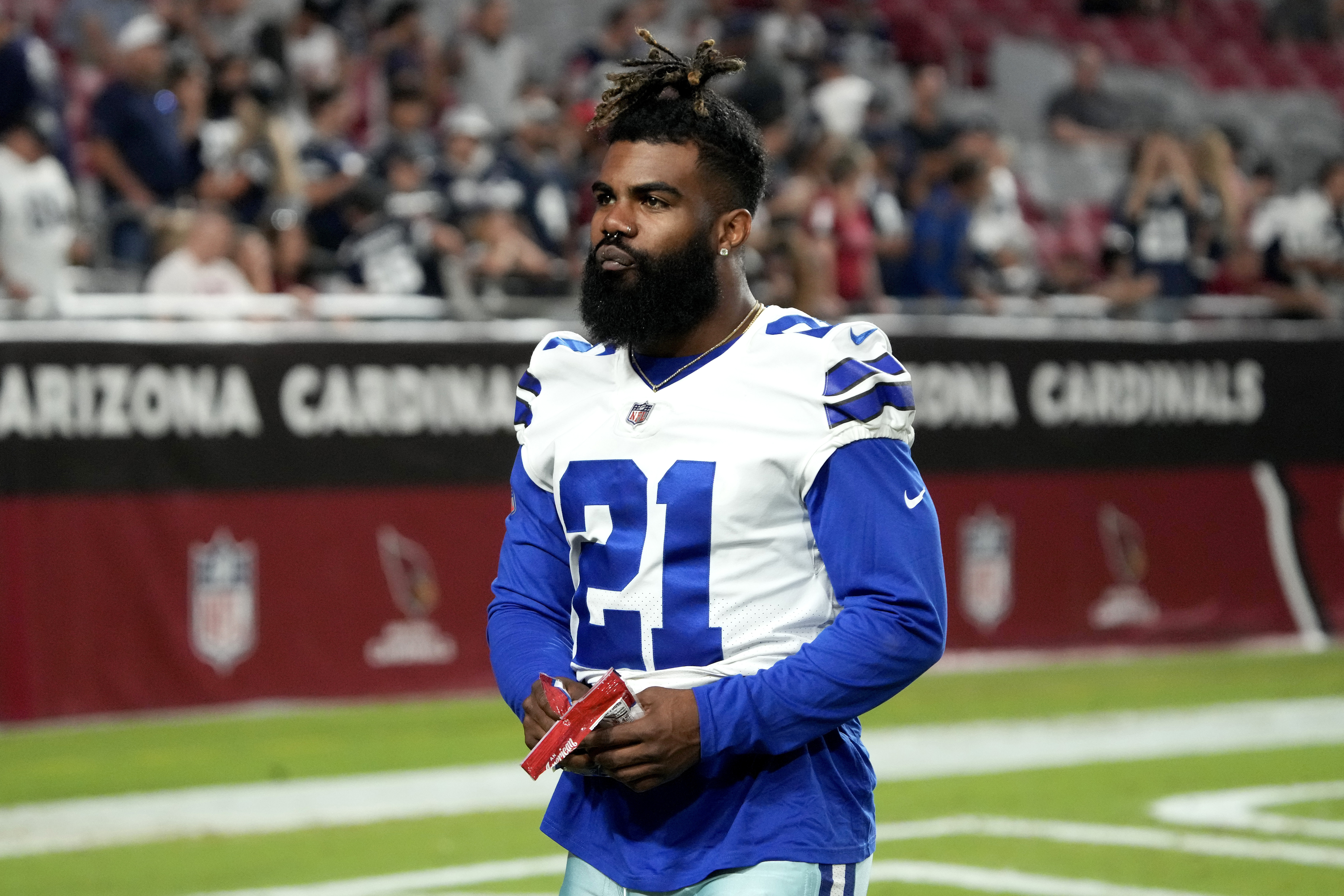 Dallas Cowboys running back Ezekiel Elliott walks on the field