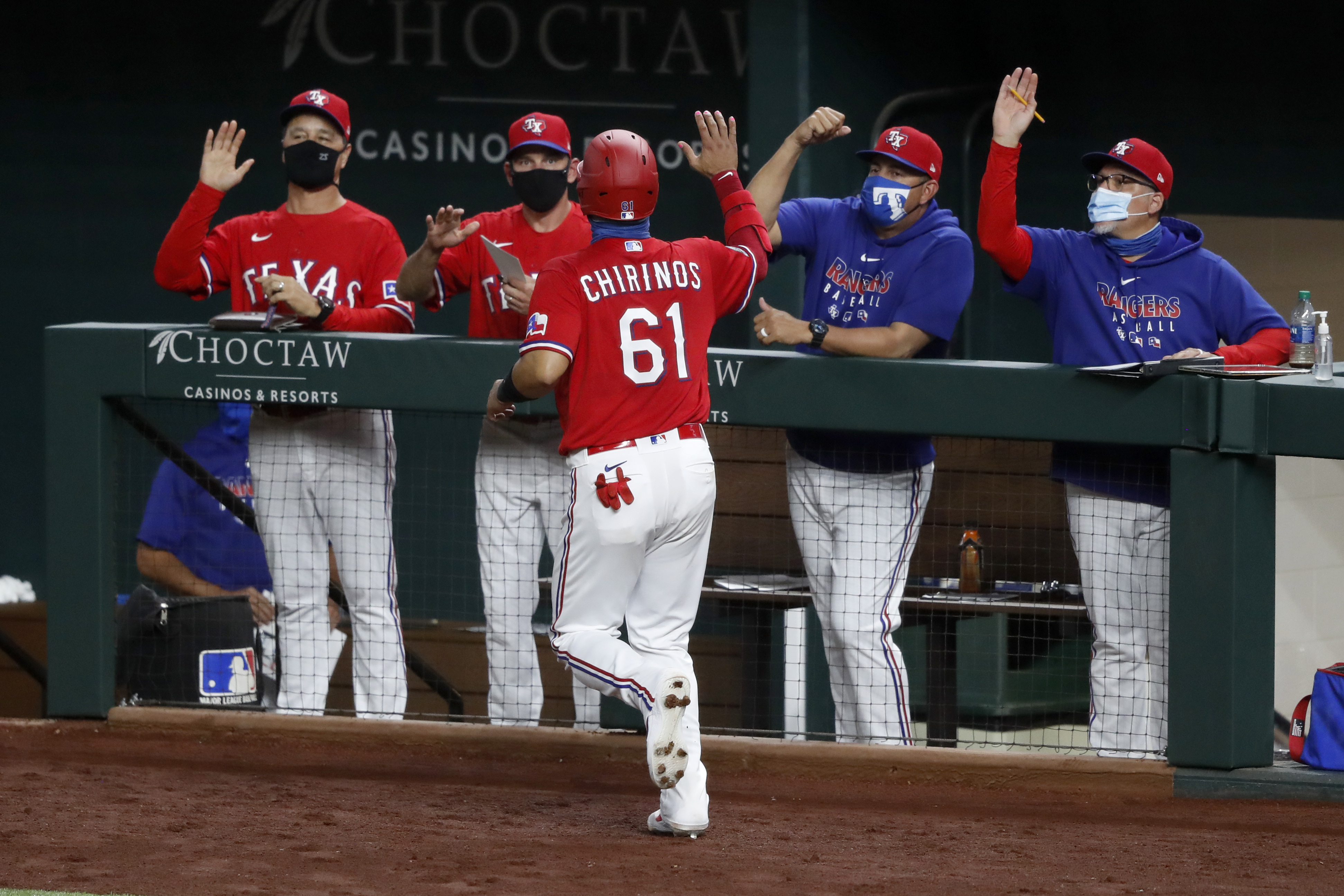 Texas Rangers' Shin-Soo Choo hits a sacrifice fly to score Rougned