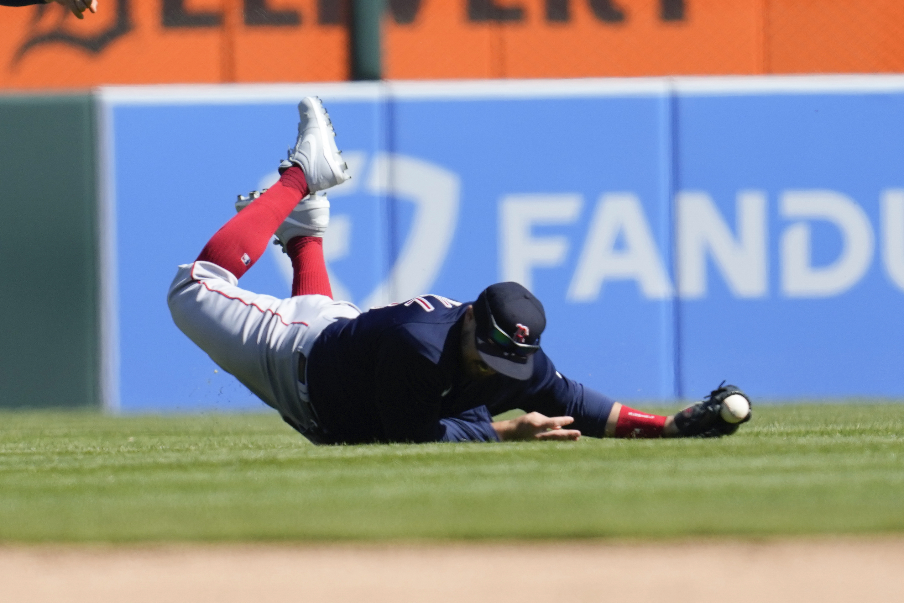 Cincinnati Reds - Adam Duvall cuts a slit in his back pocket for