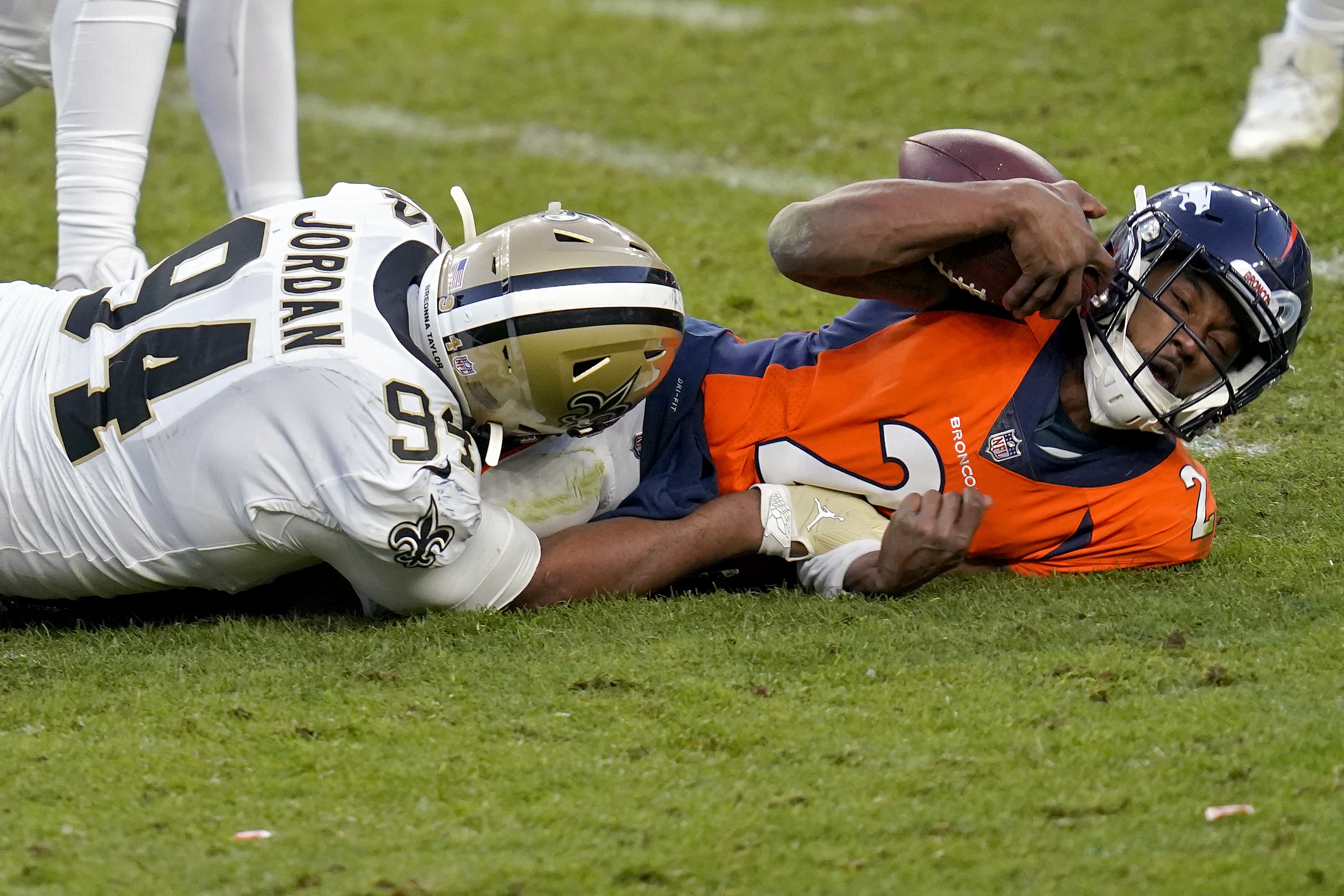 Quarterback John Elway of the Denver Broncos scans the defense as