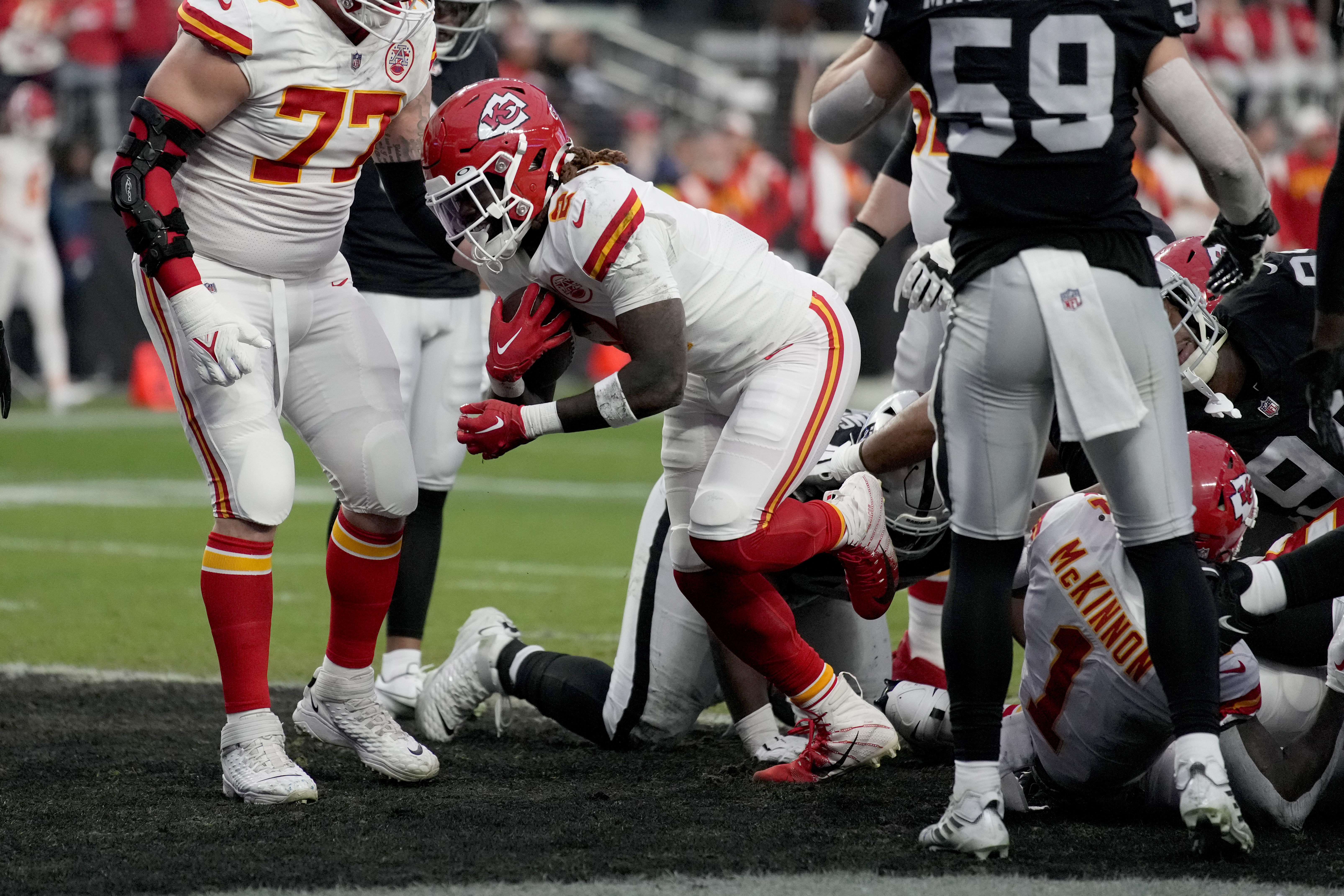 Kansas City Chiefs running back Jerick McKinnon (1) celebrates with  teammates after a Chiefs touchdown against the Las Vegas Raiders in an NFL  football game, Saturday, Jan. 7, 2023, in Las Vegas