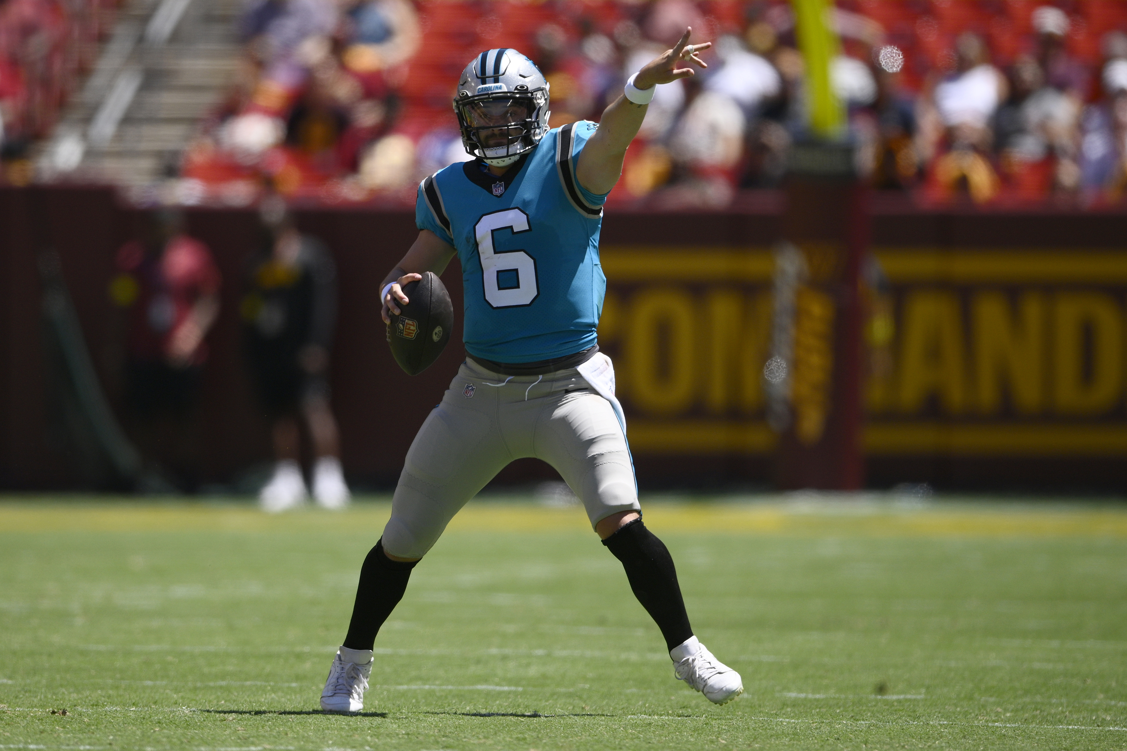 Washington Commanders quarterback Carson Wentz (11) in action during the  first half of a preseason NFL football game against the Carolina Panthers,  Saturday, Aug. 13, 2022, in Landover, Md. (AP Photo/Nick Wass