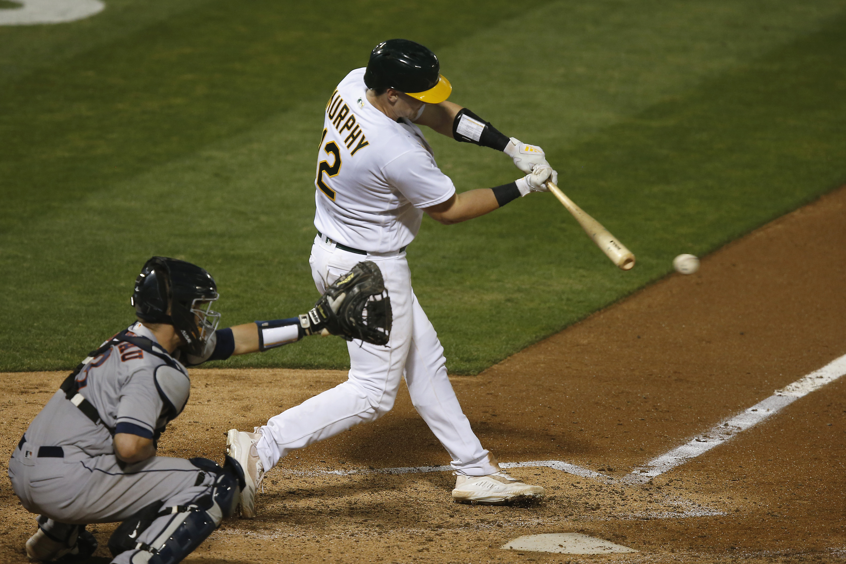 Puerto Rico's Martin Maldonado, right, slides into home to score