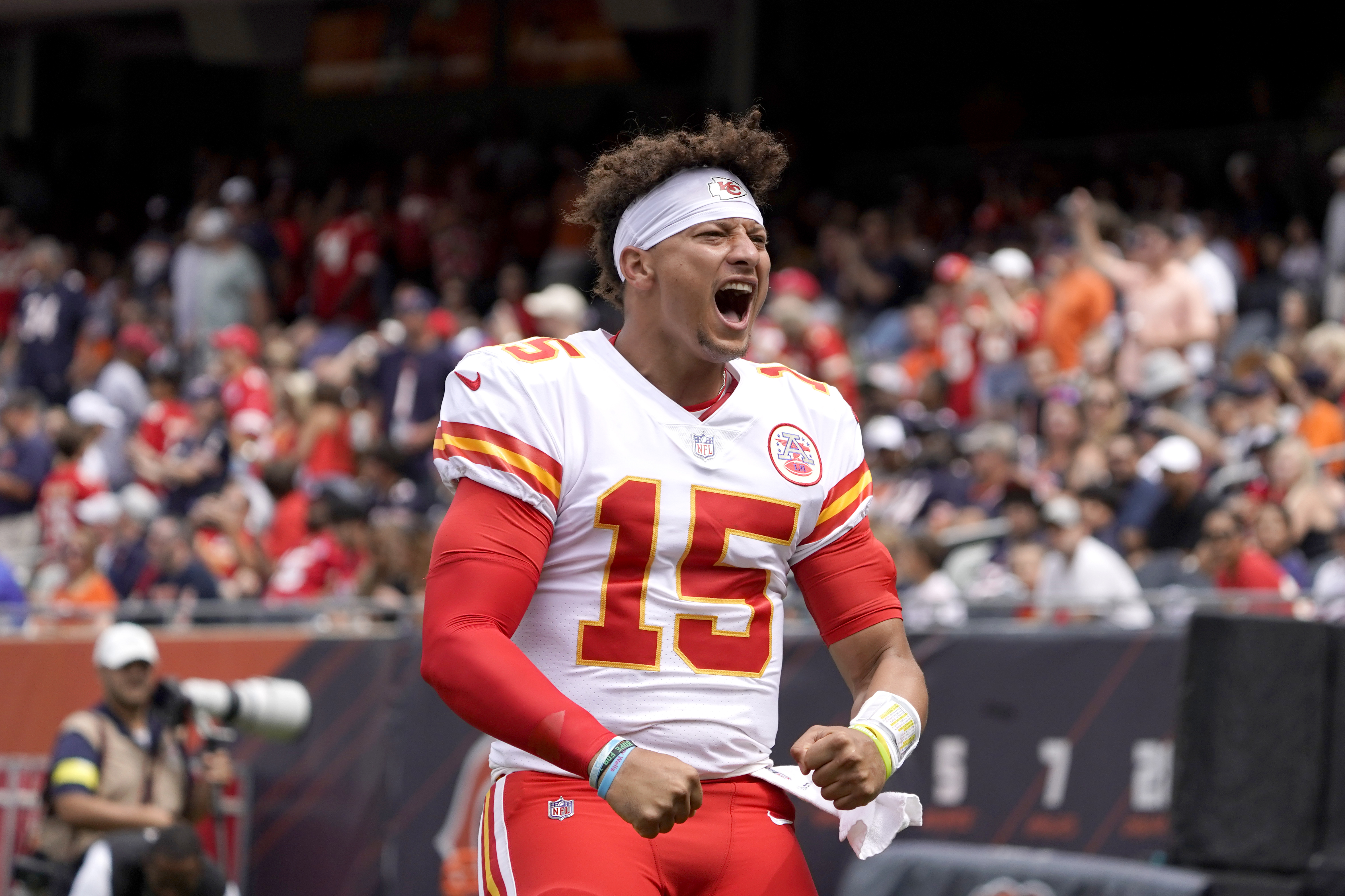 Kansas City Chiefs quarterback Patrick Mahomes (15) runs for a 12-yard  touchdown against the Chicago Bears in the first half of an NFL football  game in Chicago, Sunday, Dec. 22, 2019. (AP