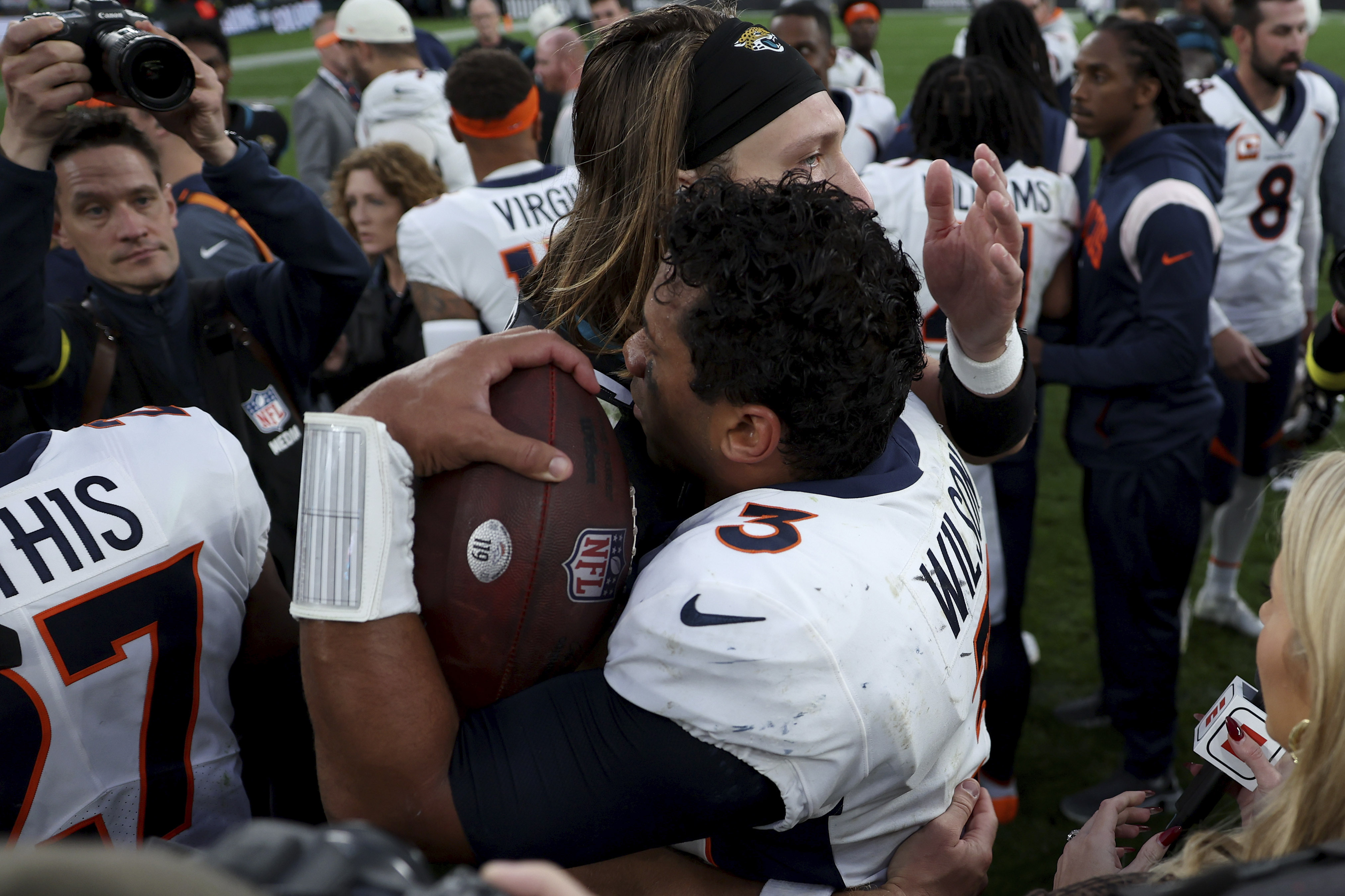 Russell Wilson, Pete Carroll Snipe at Each Other Over Playbook Wristbands