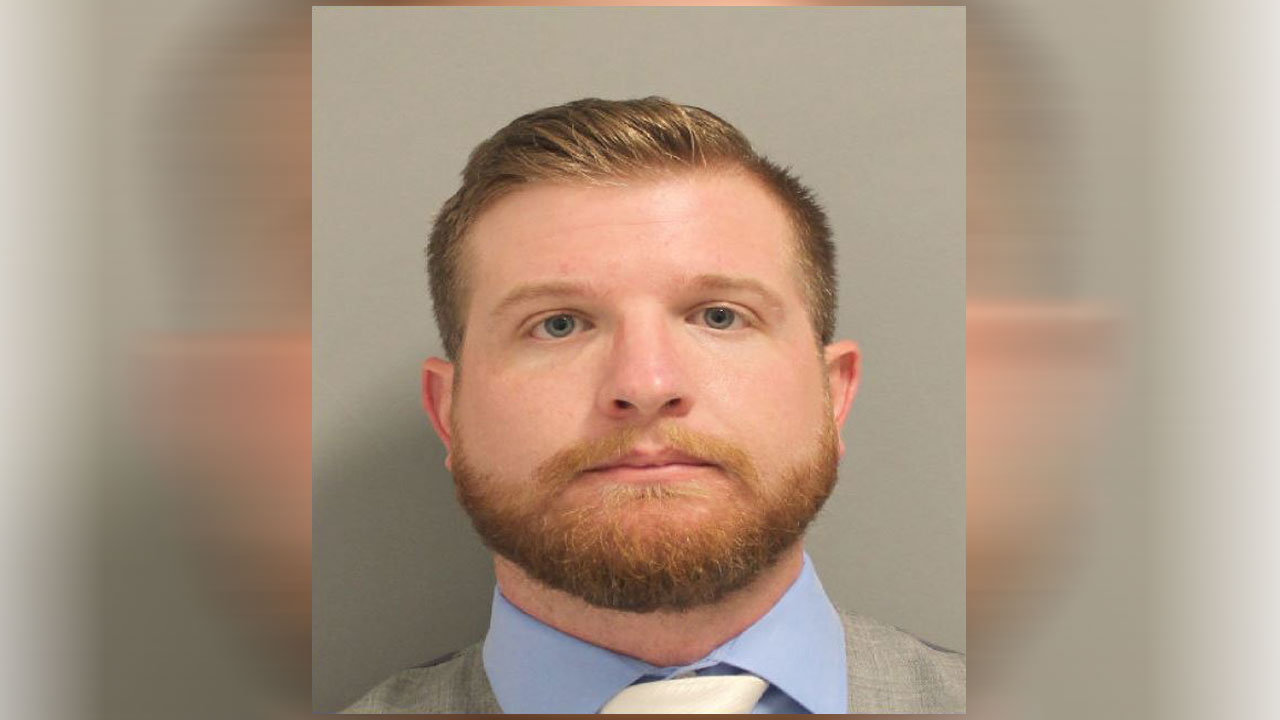 Former ExxonMobil employee accused of taking upskirt photos of female employees over past year, docs pic