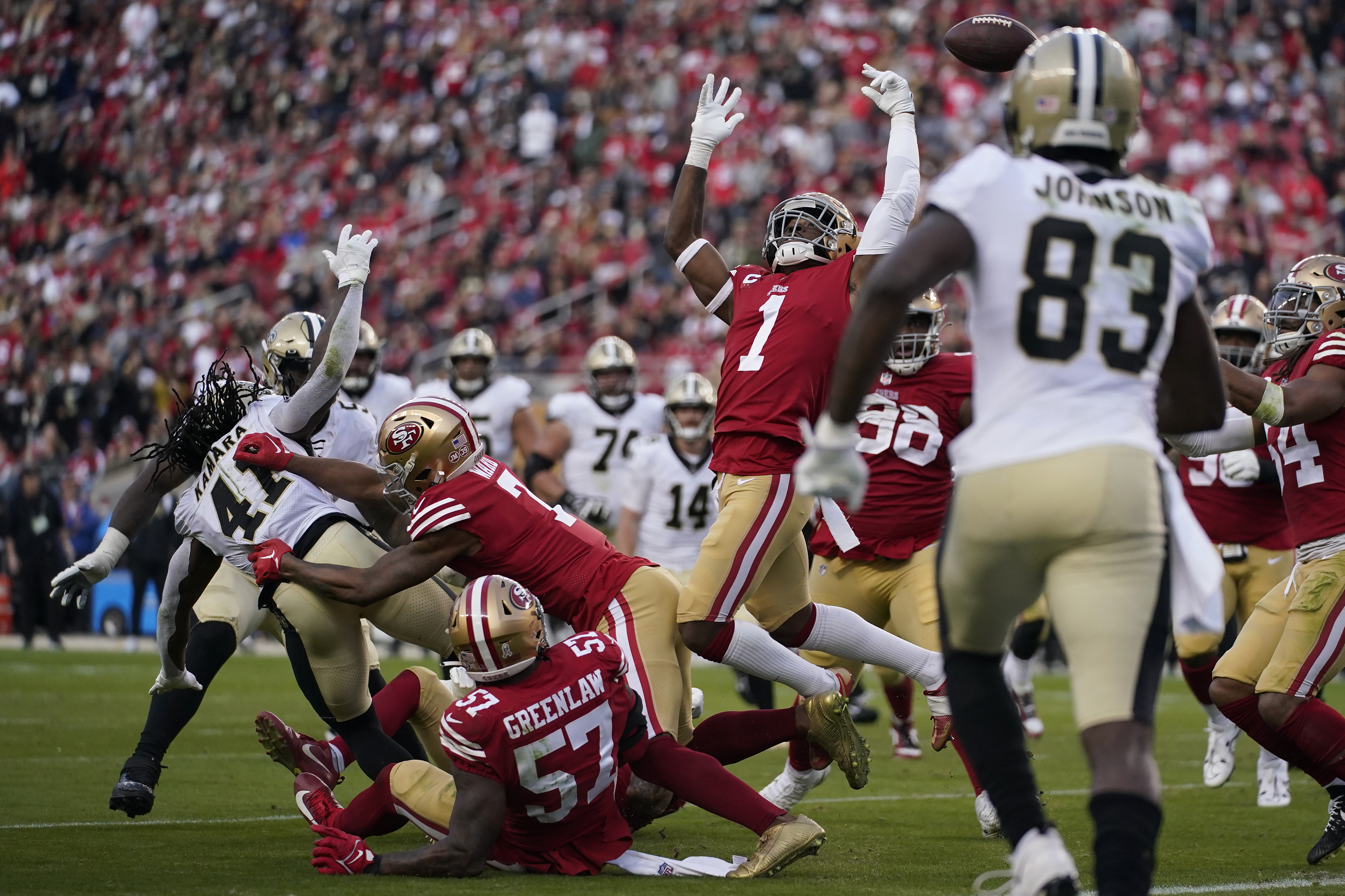 San Francisco 49ers' Fred Warner (54) and teammates celebrate his  interception against the Kans …