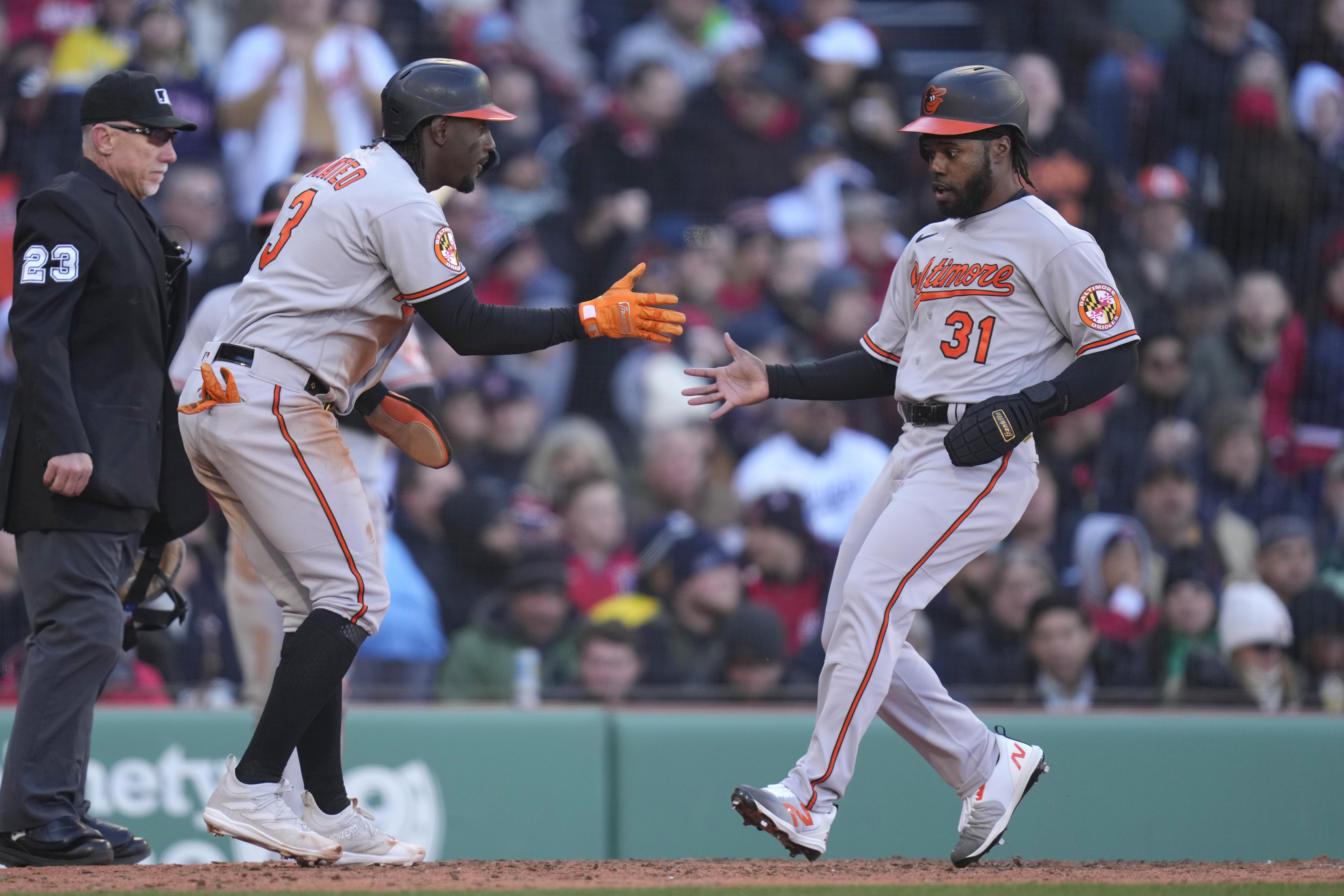 Jorge Mateo of the Baltimore Orioles throws to first base on a