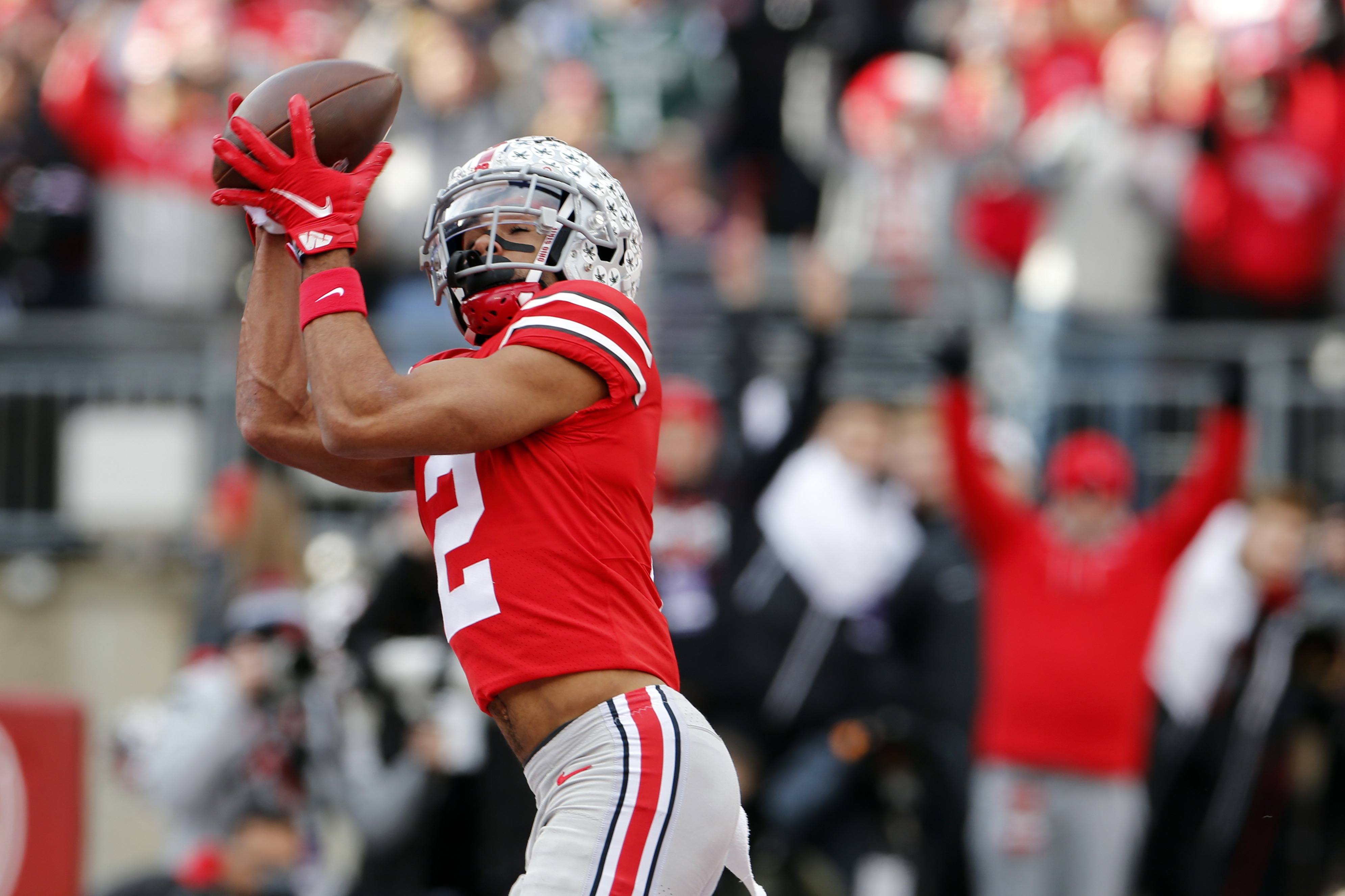 Chris Olave of the Ohio State Buckeyes celebrates after a touchdown