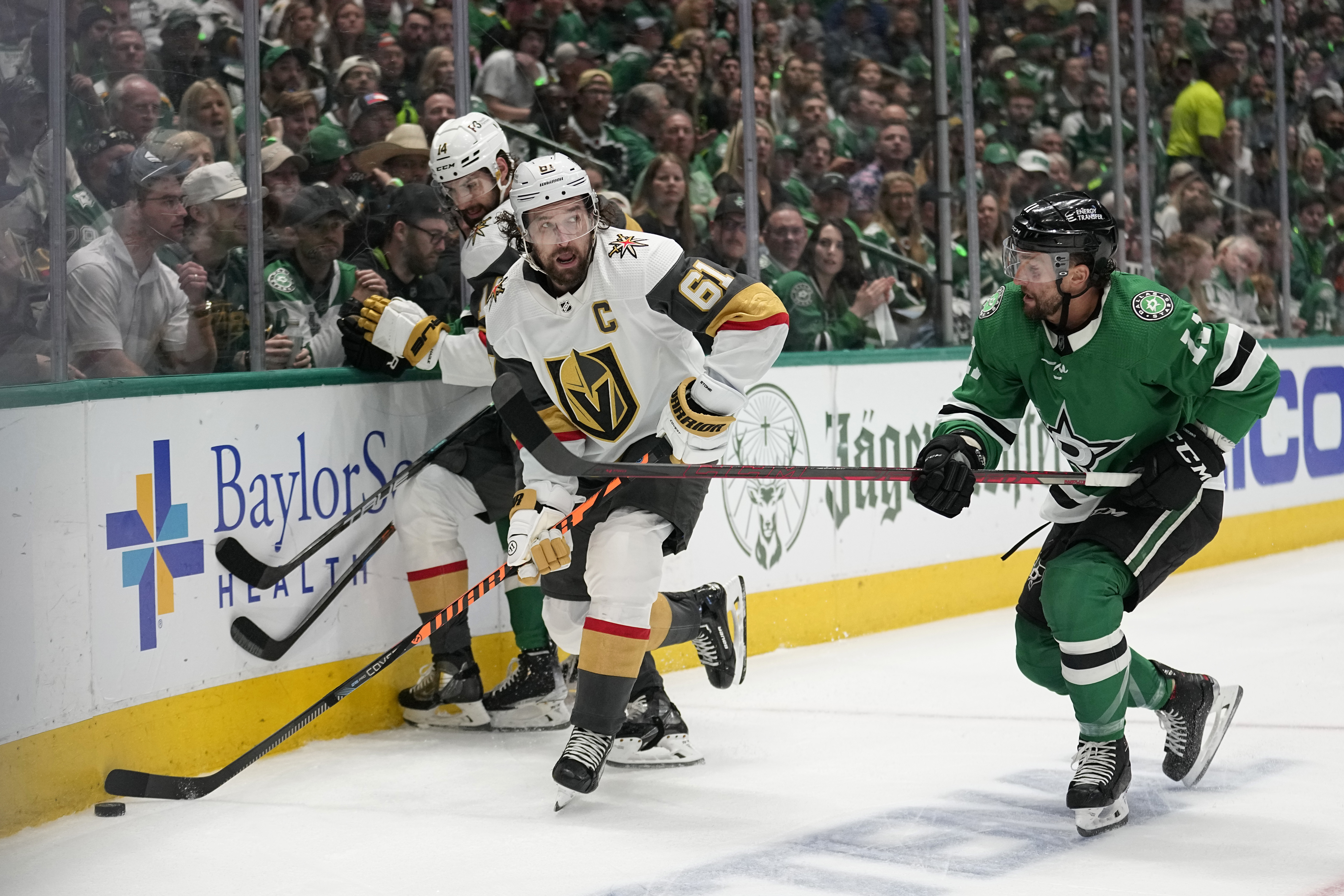 Vegas Golden Knights defenseman Alec Martinez, left, kicks a