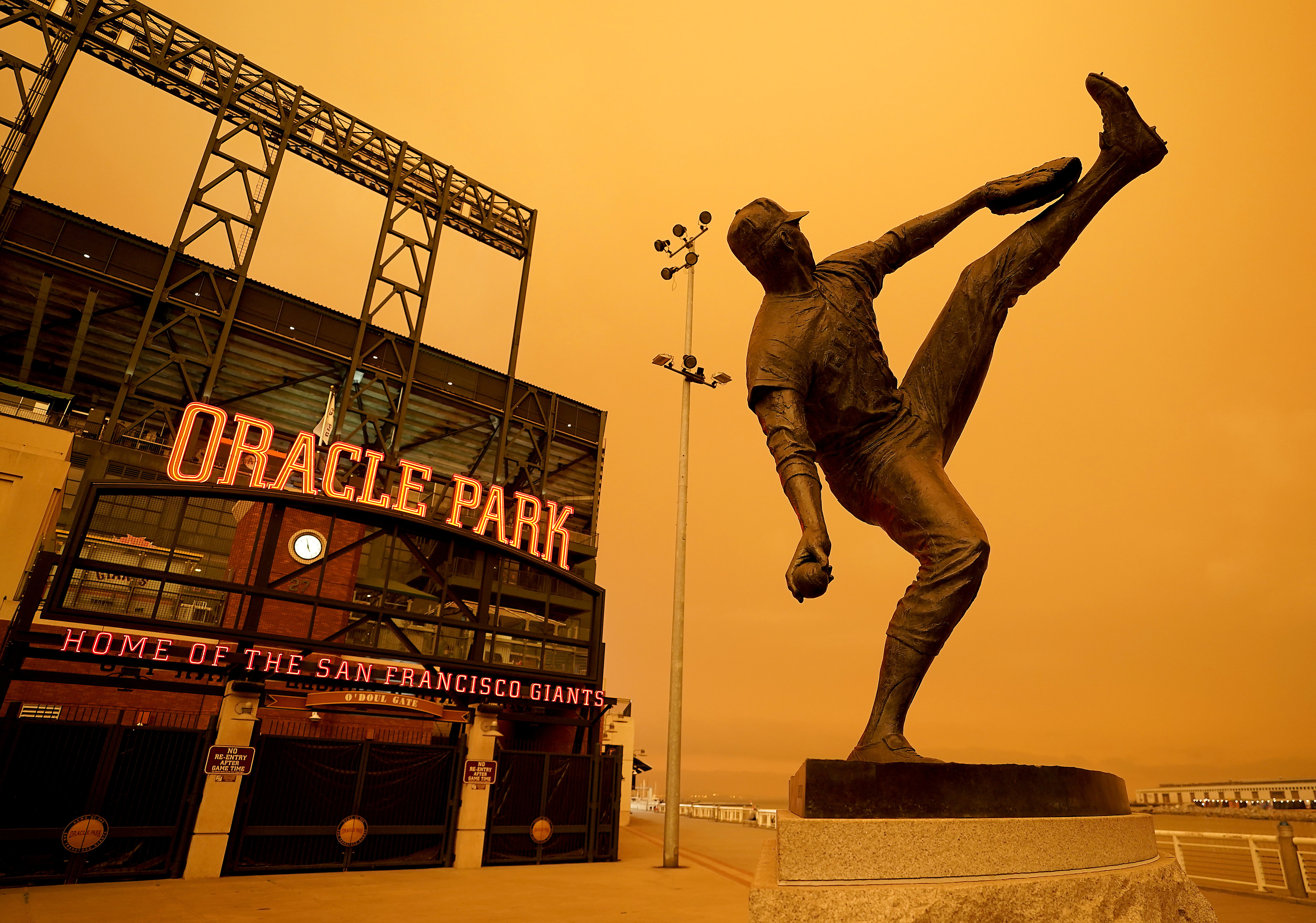 Smoke from wildfires creates eerie baseball scene in California