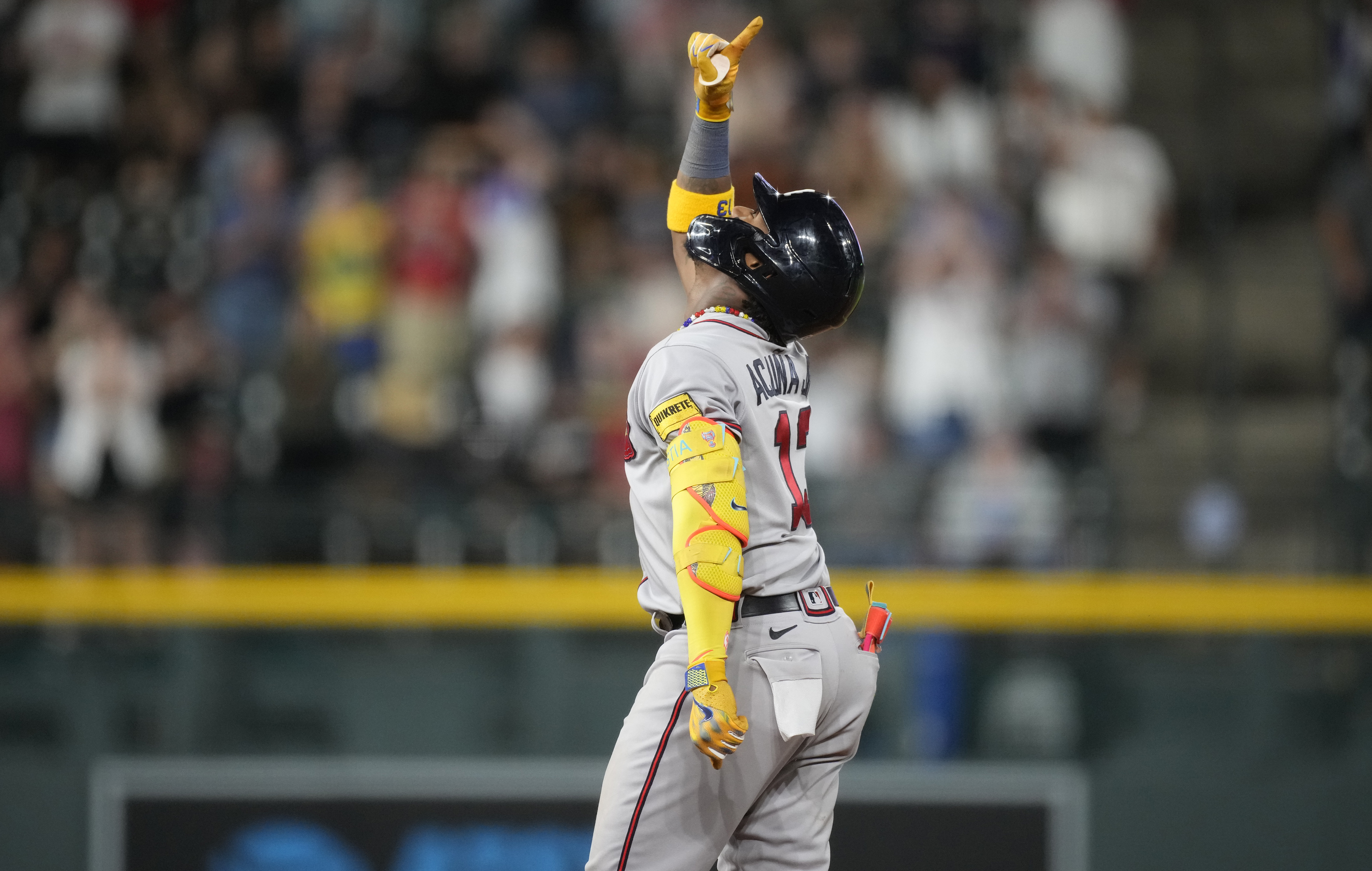 Ronald Acuña Jr. knocked over by fan charging field in Colorado, but Braves  star says he's OK – KXAN Austin