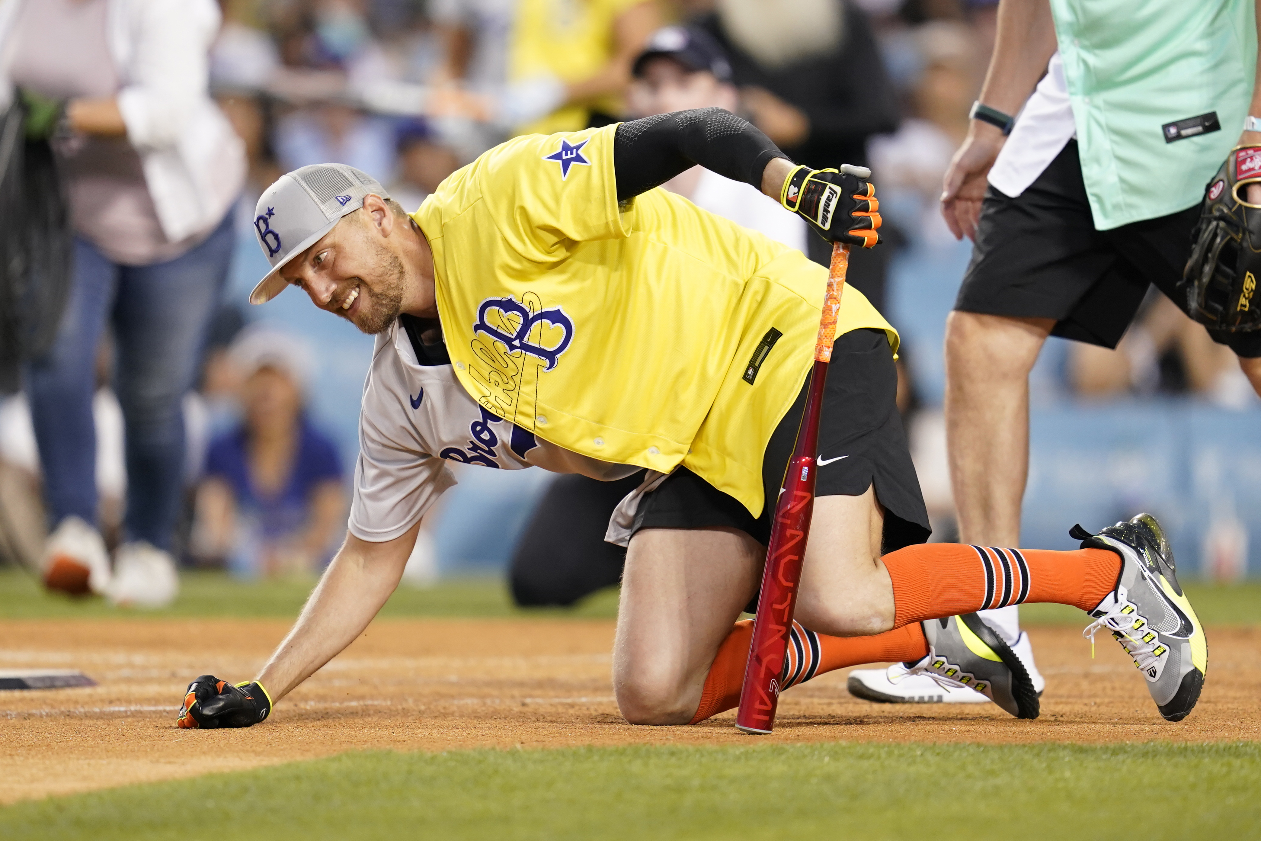 Rapper and singer Bad Bunny runs in the outfield during the MLB All Star  Celebrity Softball game, Saturday, July 16, 2022, in Los Angeles. (AP  Photo/Mark J. Terrill)