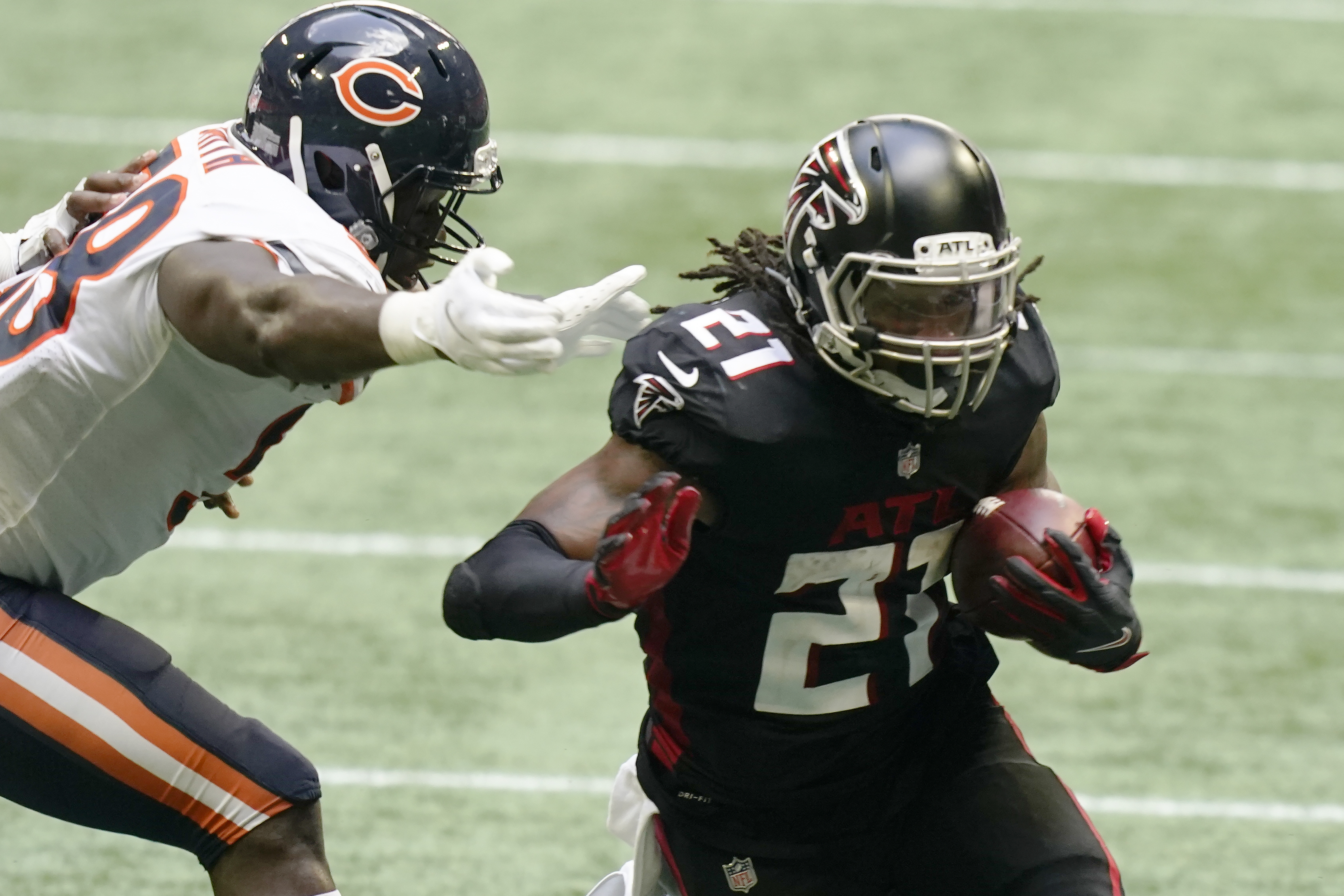 Isaiah Oliver and Foyesade Oluokun of the Atlanta Falcons