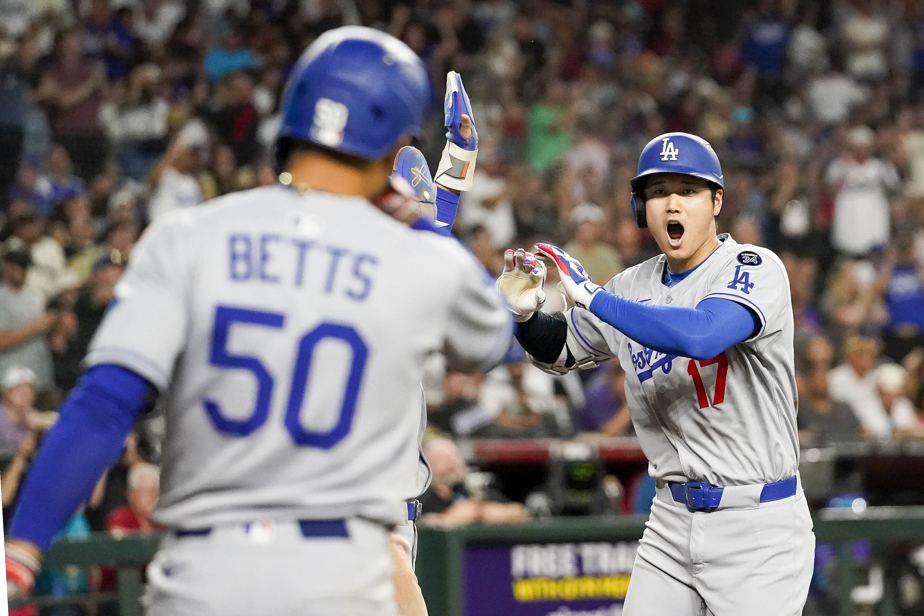 Ohtani hits 3-run homer in 9th to cap Dodgers