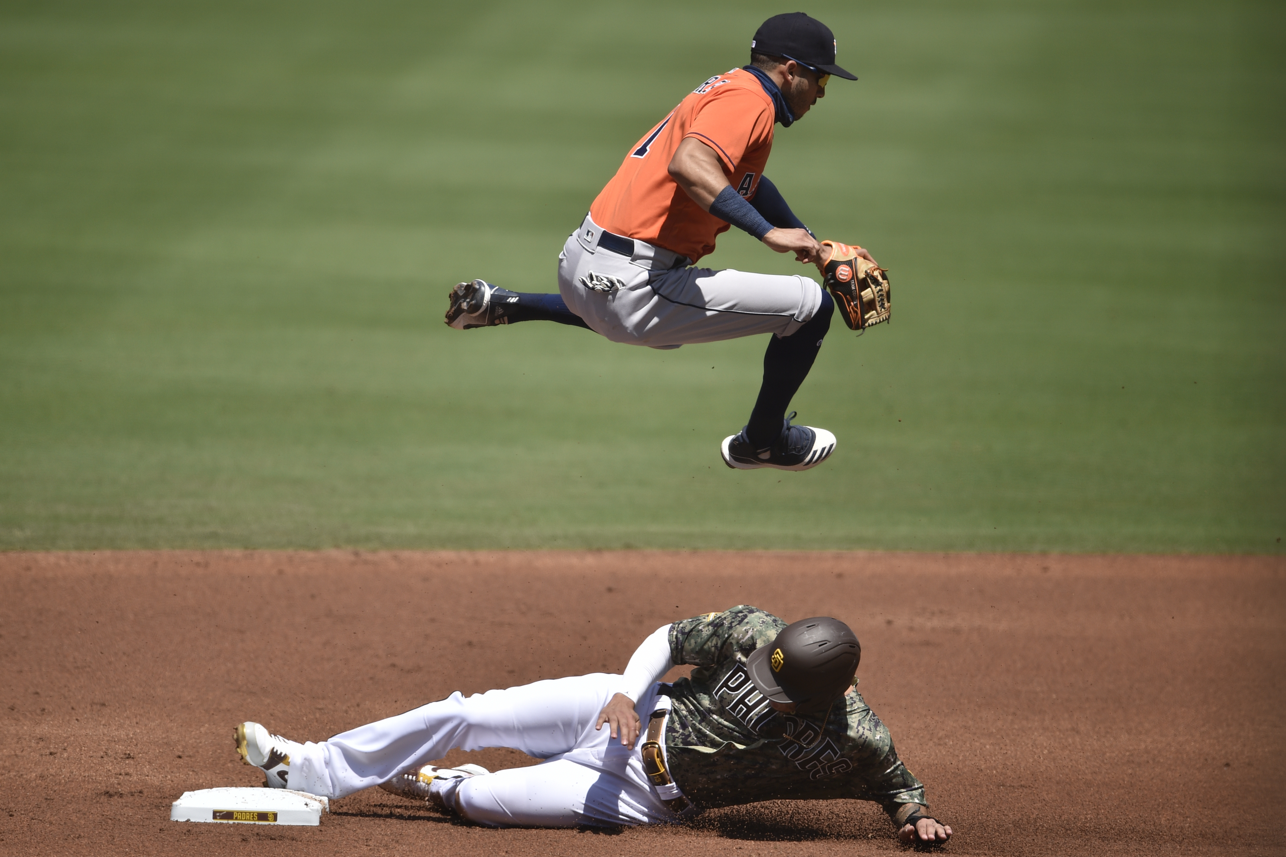 Fernando Tatis Jr. grounds into a double play, third baseman