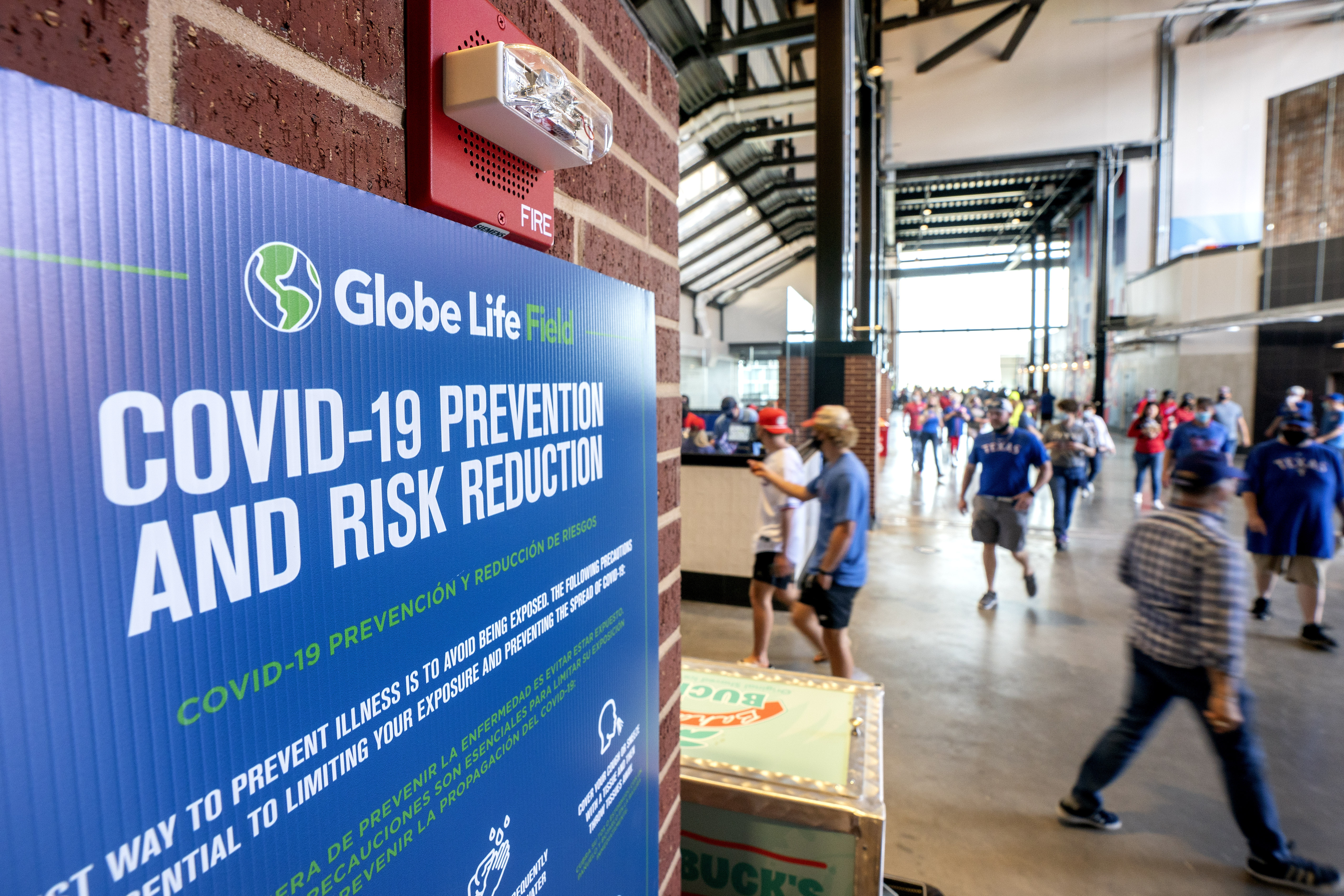 Texas Rangers fill stands with fans, who accept 'calculated risk