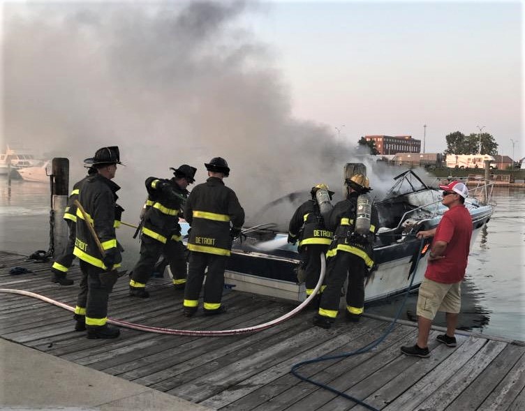 Members of the Detroit Fire Department Marine Corps spray water on the SS  Ste. Claire that was on fire at a marina in Detroit, on Friday, July, 6,  2018. The blaze on