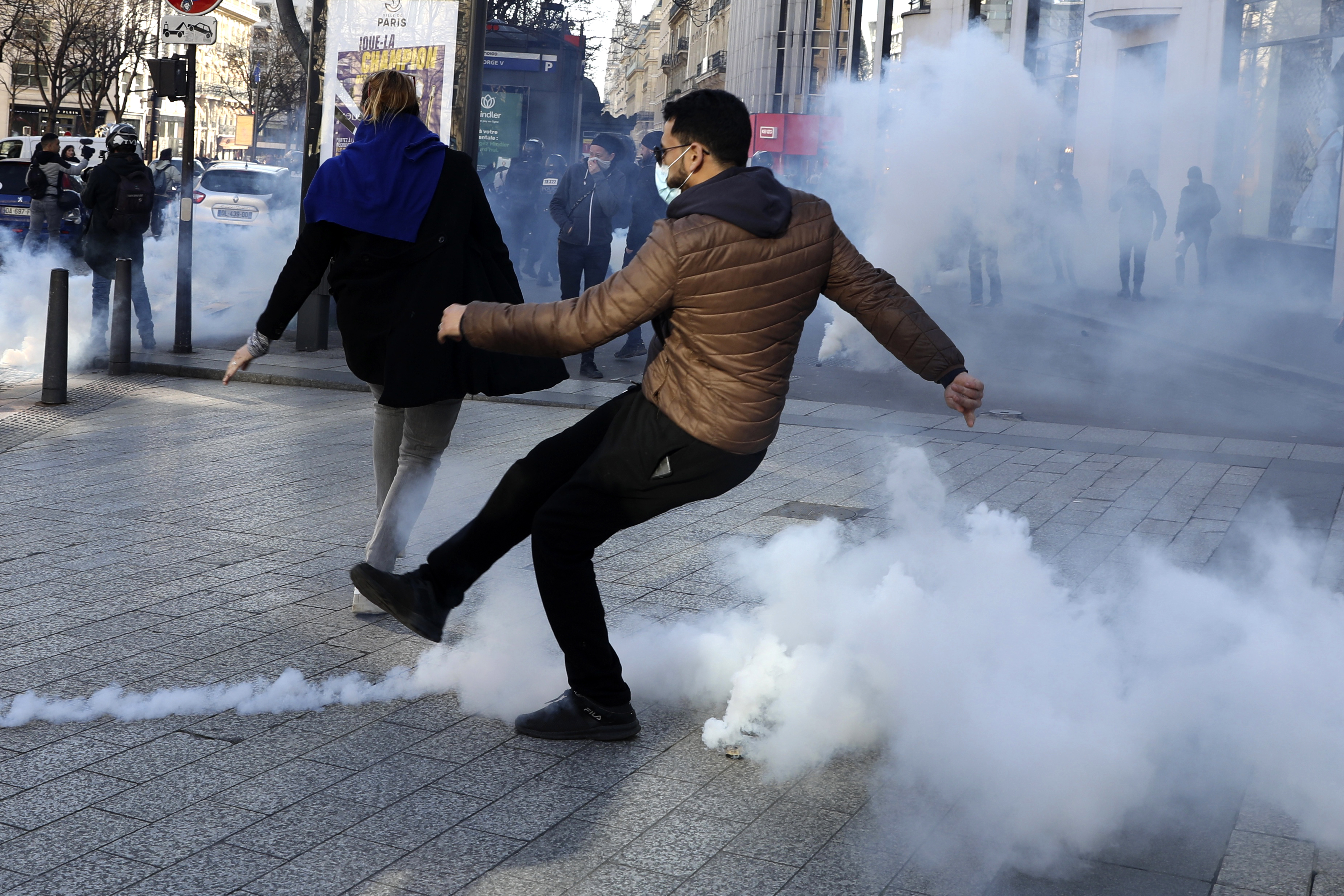 Paris police fire tear to disperse banned virus protest
