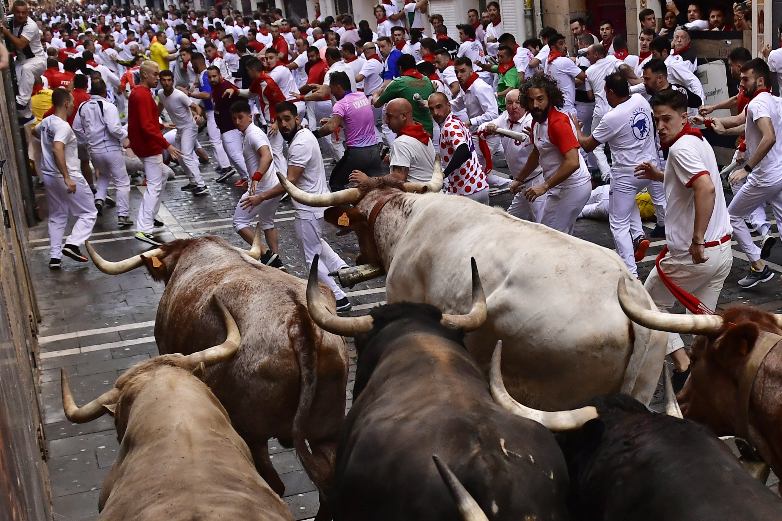 Runners hit Pamplona's streets for annual dash with the bulls
