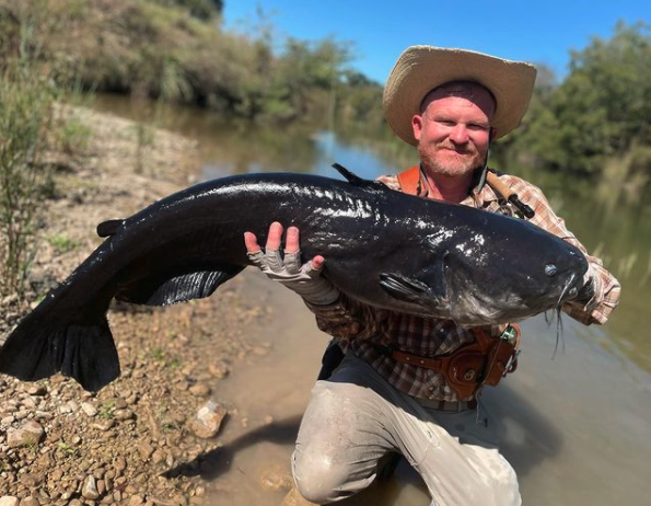Fly fish angler reels in potential world-record blue catfish in Texas river