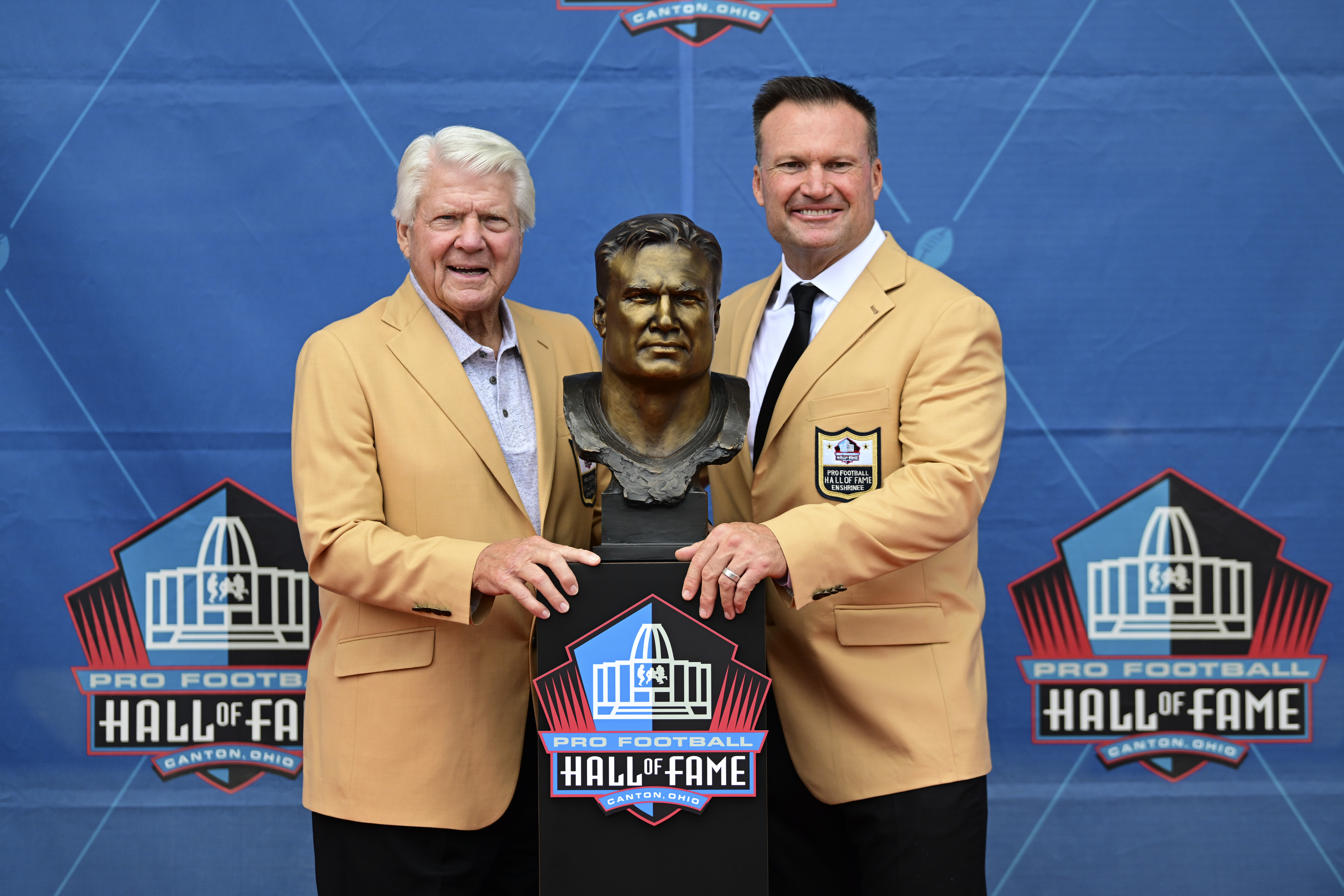 The Pro Football Hall of Fame class of 2022 pose with their busts following  an induction ceremony at the Pro Football Hall of Fame, Saturday, Aug. 6,  2022, in Canton, Ohio. From