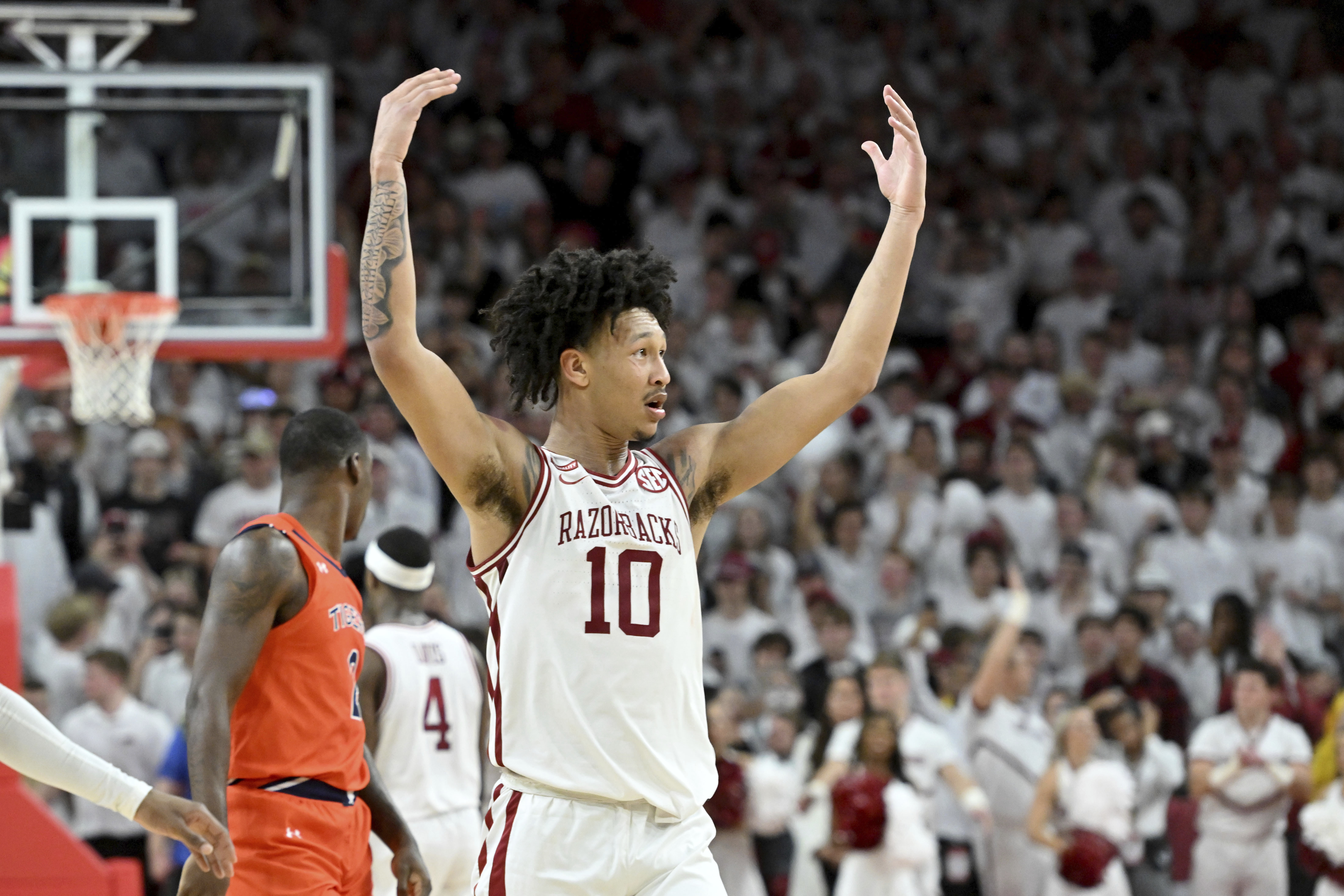 Hog wild! Unranked Arkansas upsets No. 1 Auburn 80-76 in OT