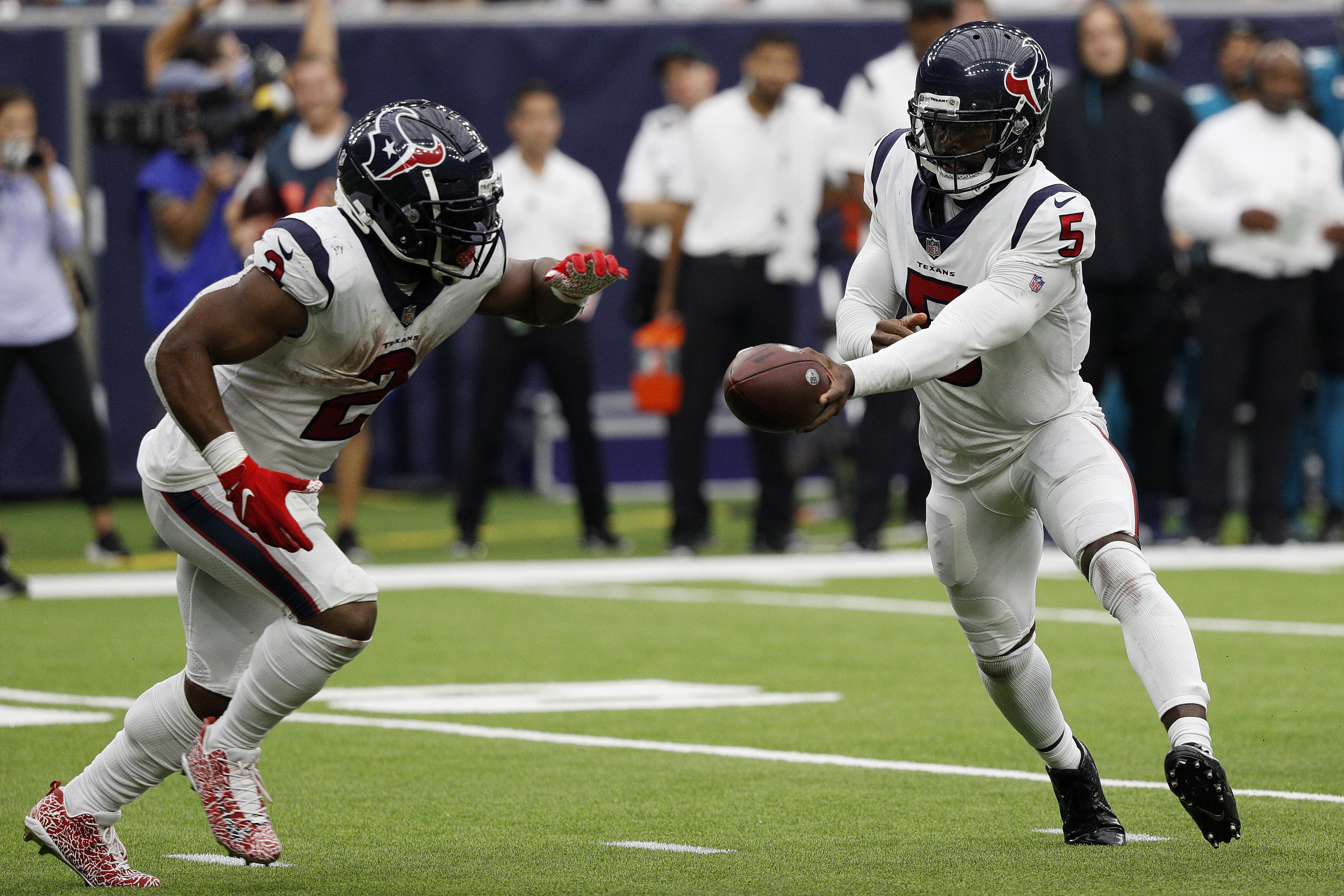 Houston Texans quarterback Tyrod Taylor (5) hands the ball off to Houston  Texans running back Mark Ingram II (2) during the first half of an NFL  football game Sunday, Sept. 12, 2021