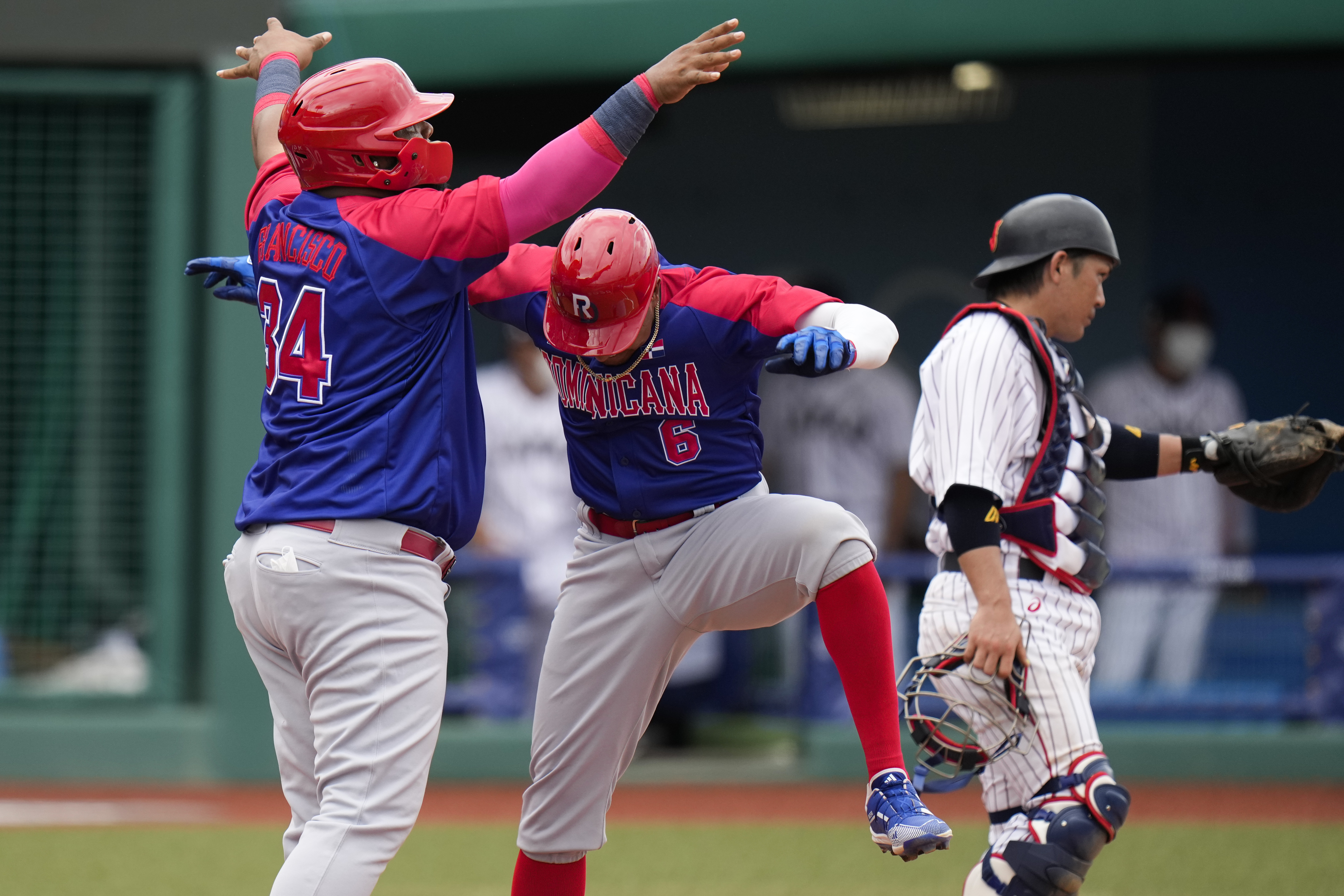 Timely bunt rallies Japan past DR in 9th in Olympic opener