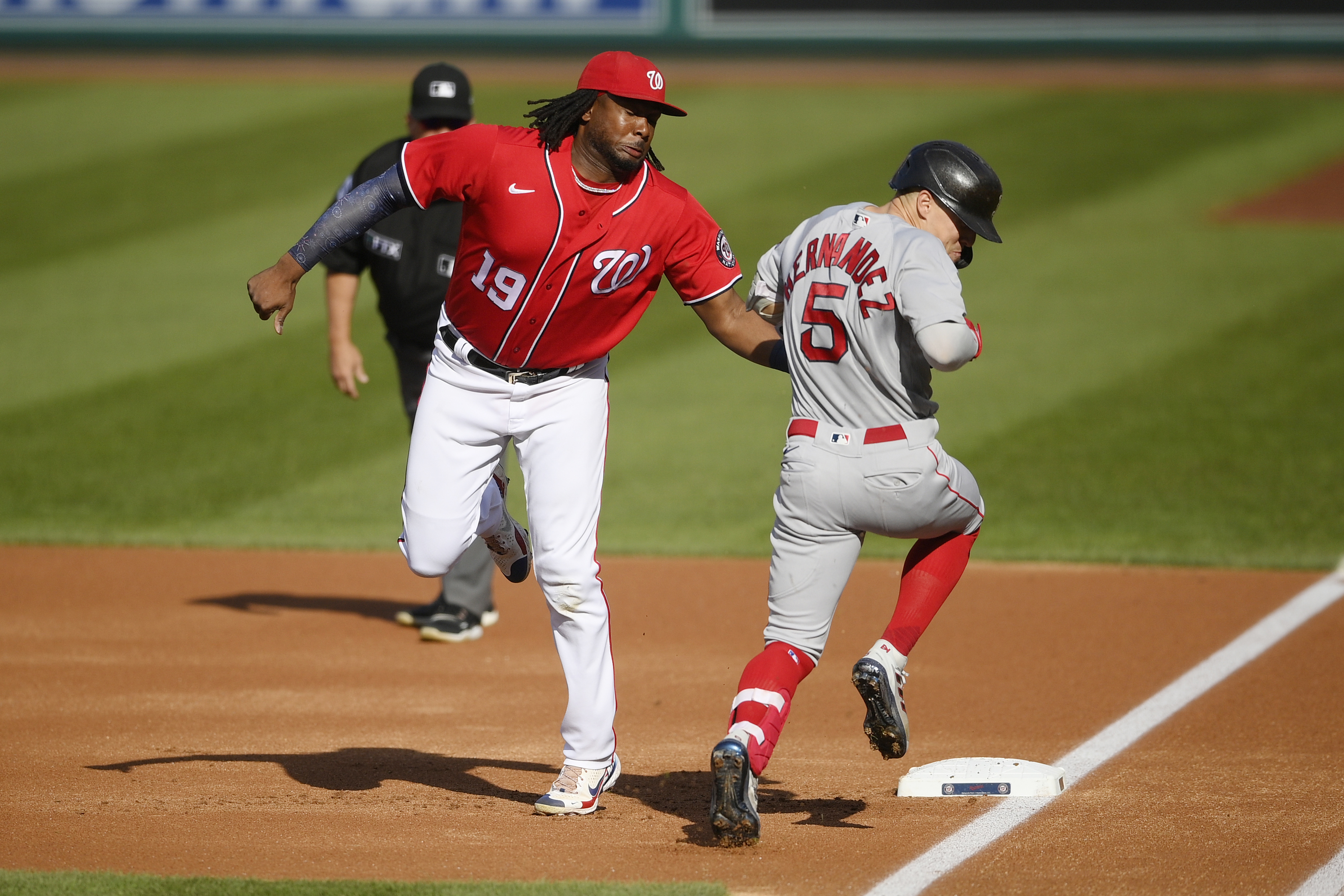 Boston Red Sox's Bobby Dalbec celebrates with Enrique Hernandez