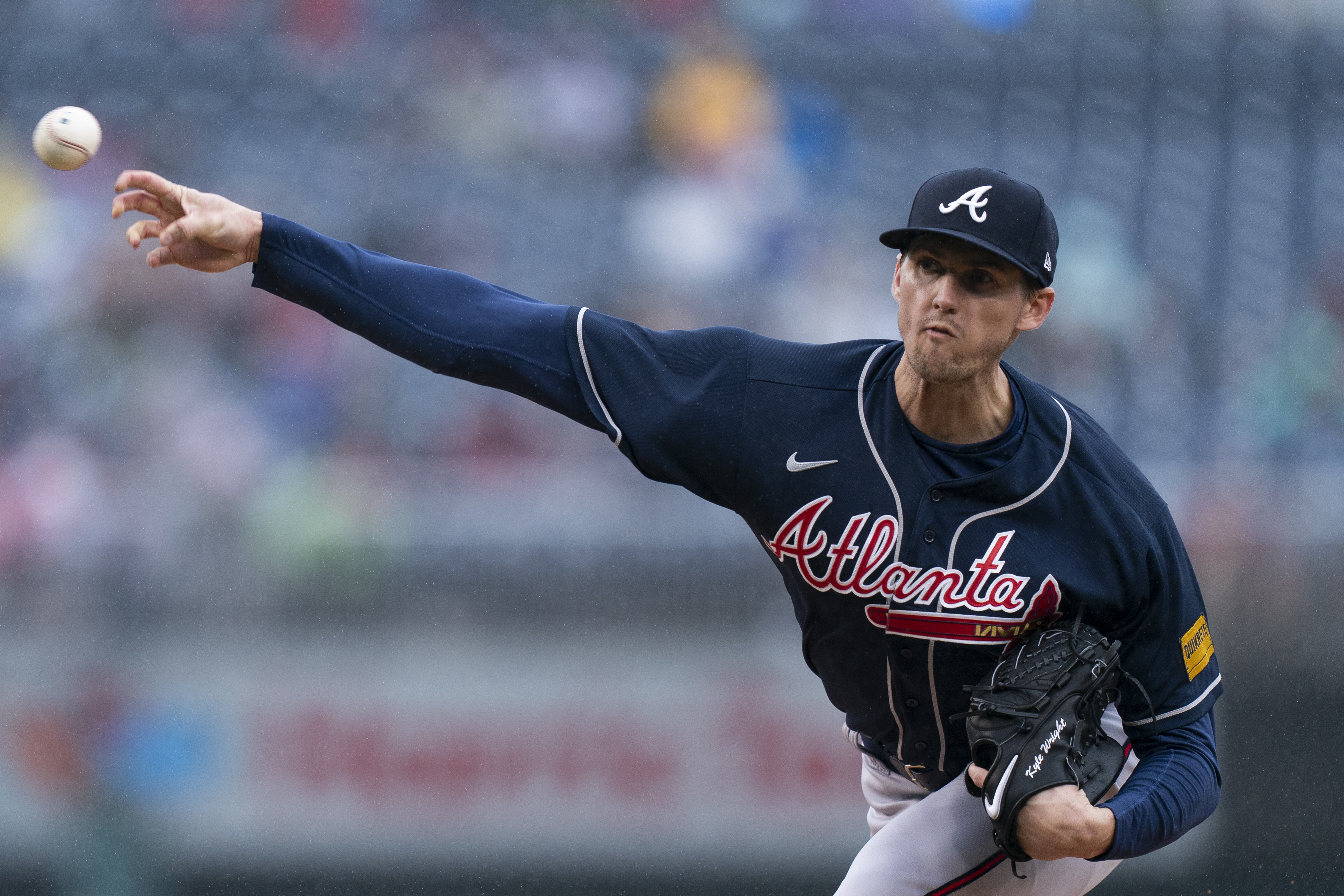 Matt Olson of the Atlanta Braves and Max Fried watch a replay on