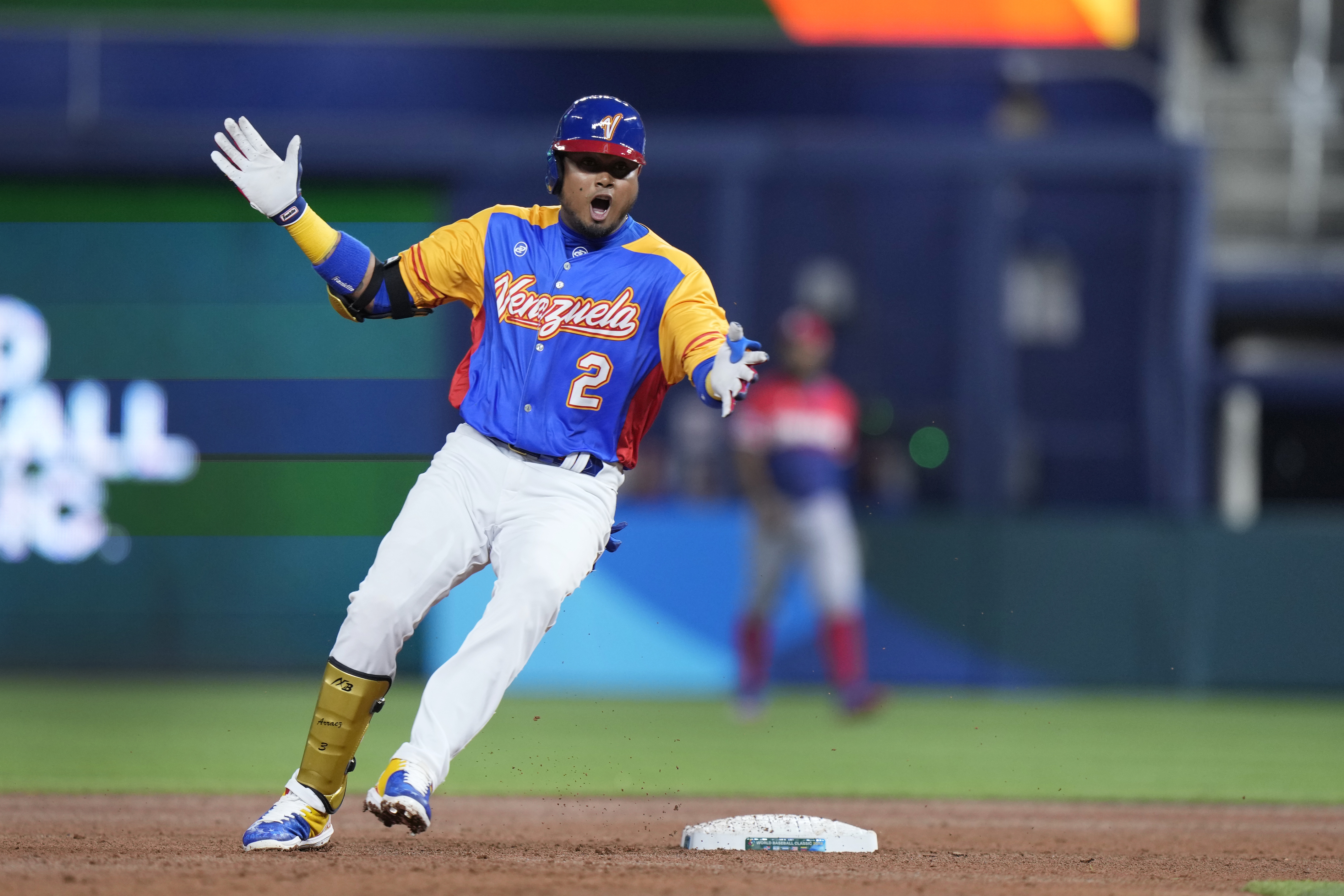 Venezuela first baseman Luis Arraez (2) and third baseman Eugenio