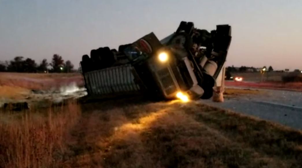 Truck hauling distillers grain overturns north of Beatrice