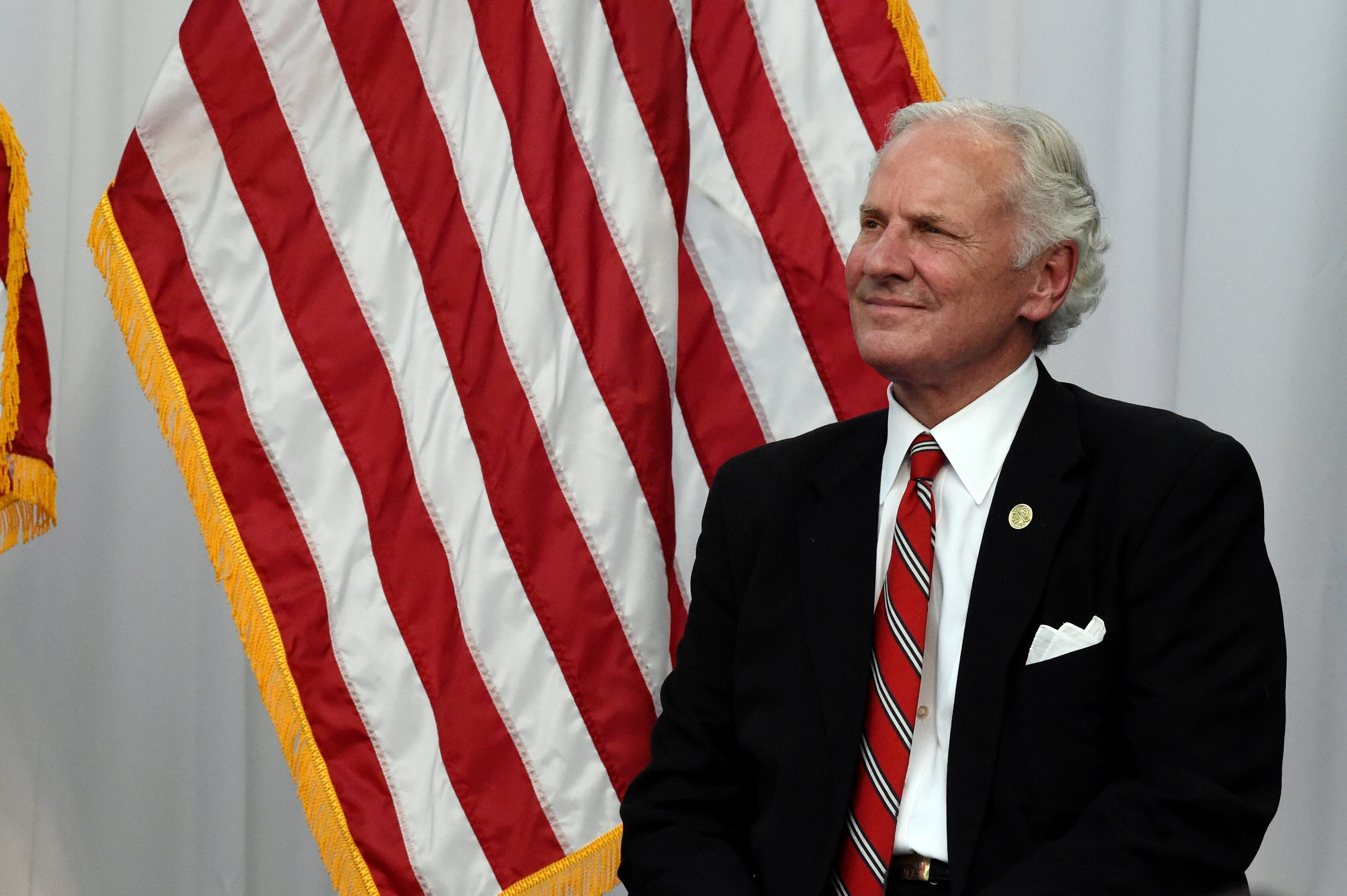 South Carolina Gov. Henry McMaster puts on a Carolina Panthers hat