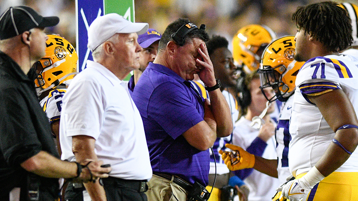 Former LSU head football coach, Ed Orgeron, right, talks to his